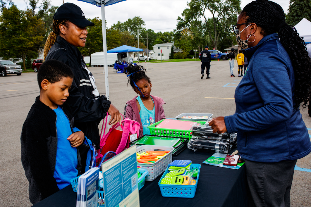 Shalonda Griffin runs the Gift of Life Michigan tent which provided school supplies during the ‘Back to School Rally’ at Bethel United Methodist Church in Flint on Saturday, Sept. 9, 2023. (Jenifer Veloso | Flintside.com)
