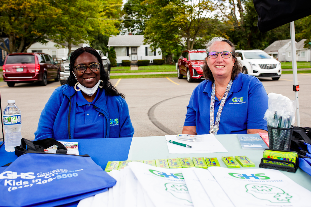 Genesee Health System staff members ran a tent offering information on GHS services during the ‘Back to School Rally’ at Bethel United Methodist Church in Flint on Saturday, Sept. 9, 2023. (Jenifer Veloso | Flintside.com)