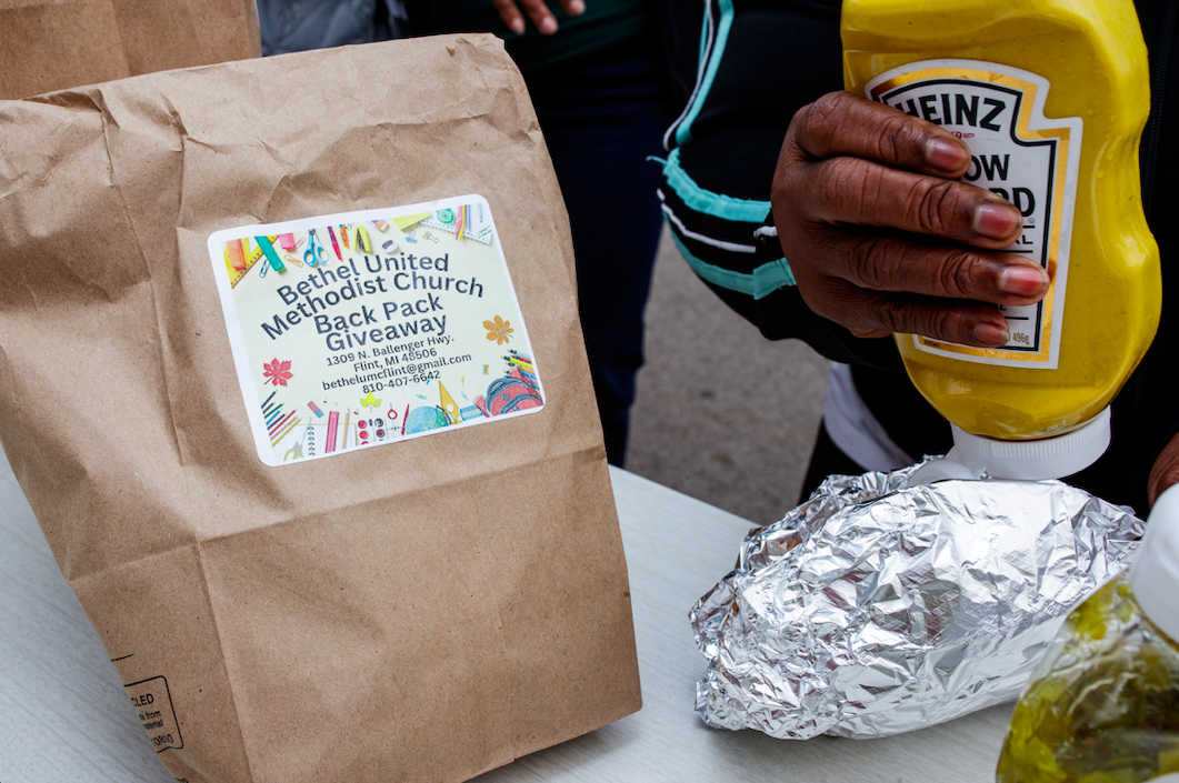 Hot dogs were provided during the ‘Back to School Rally’ at Bethel United Methodist Church in Flint on Saturday, Sept. 9, 2023. (Jenifer Veloso | Flintside.com)