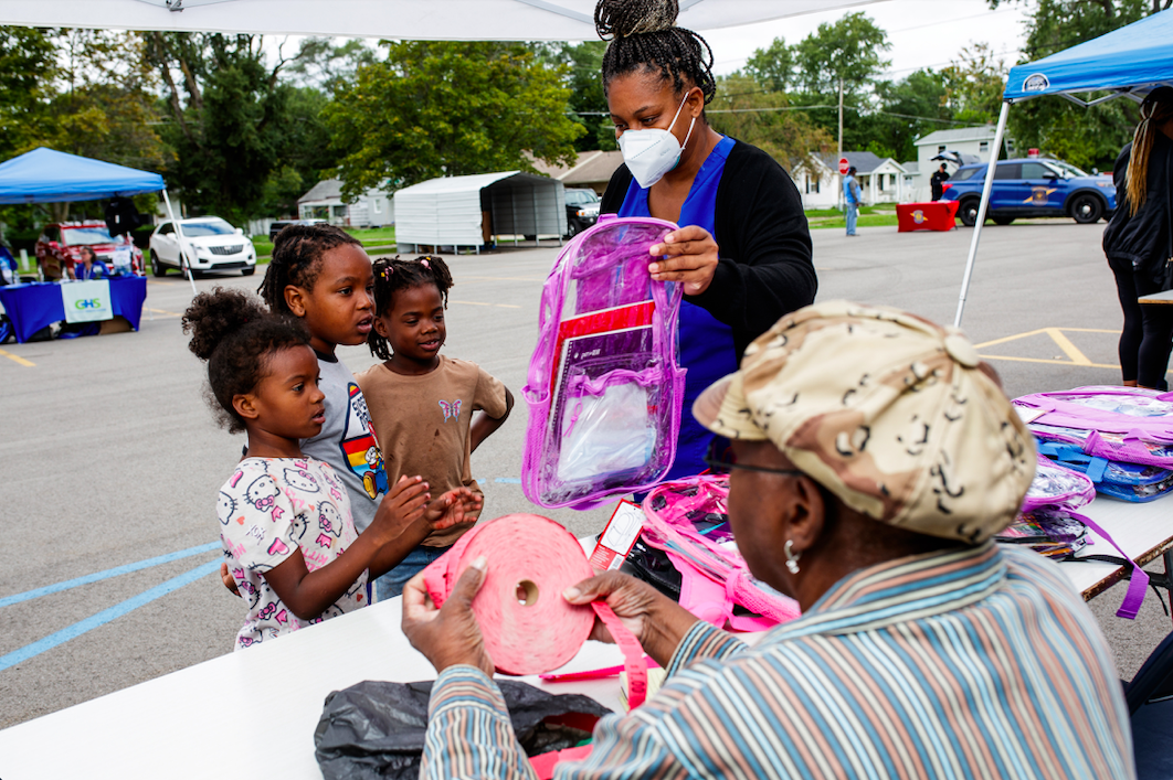 Attendants grab free backpacks and school supplies during the ‘Back to School Rally’ at Bethel United Methodist Church in Flint on Saturday, Sept. 9, 2023. (Jenifer Veloso | Flintside.com)