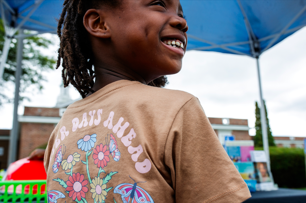 Maiayla smiles while collecting free school supplies during the ‘Back to School Rally’ at Bethel United Methodist Church in Flint on Saturday, Sept. 9, 2023. (Jenifer Veloso | Flintside.com)