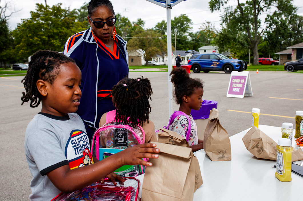 Children collect free school supplies and get hot dogs during the ‘Back to School Rally’ at Bethel United Methodist Church in Flint on Saturday, Sept. 9, 2023. (Jenifer Veloso | Flintside.com)