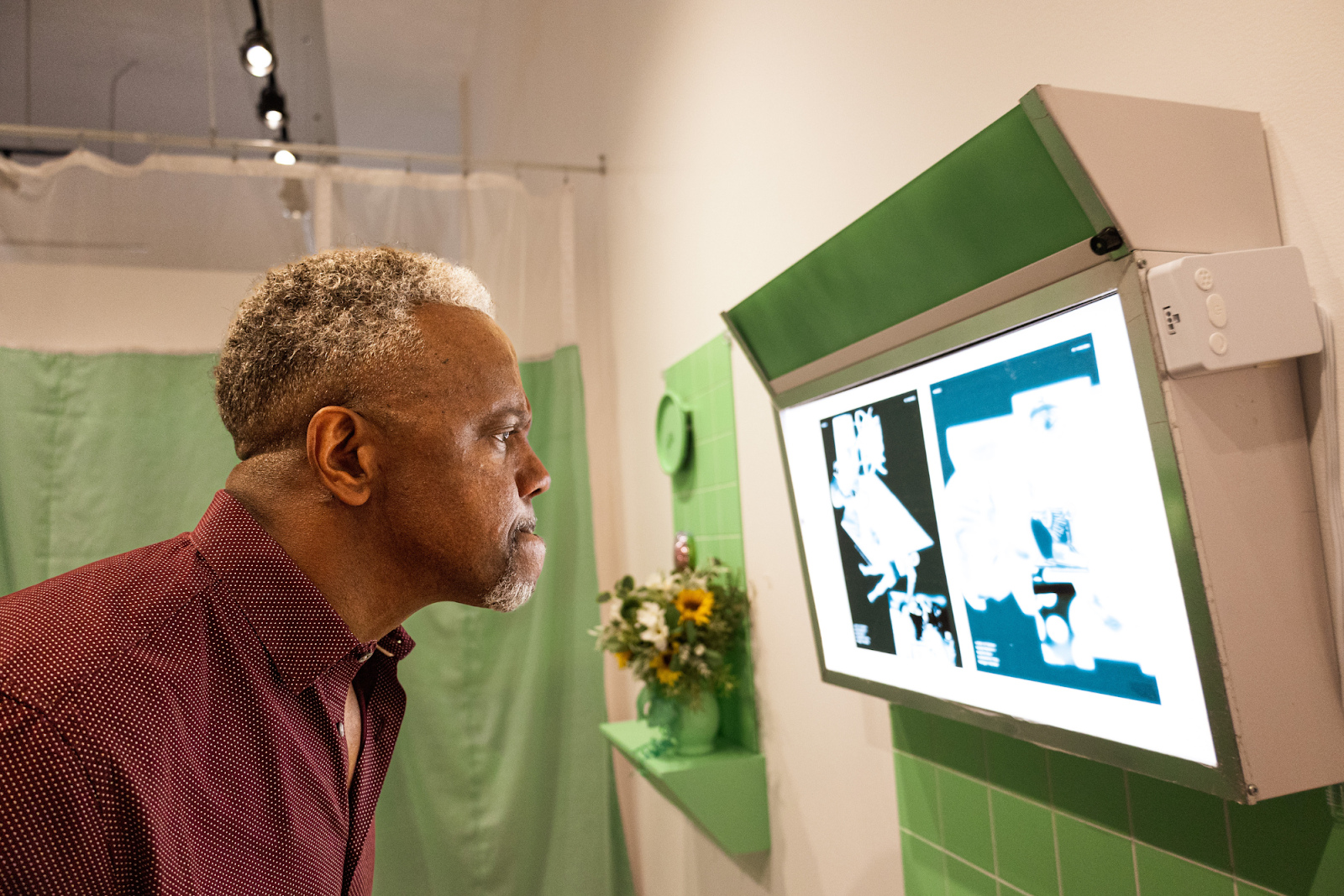 “There’ve been some exhibitions I walked in and knew right [then] what I want to say. And others I’ve walked, and I don’t know what’s happening here,” says Bob Campbell, staring at Nature is Healing by Maria Lux inside Buckham Gallery on July 29, 2023. (Anthony Summers | Flintside)