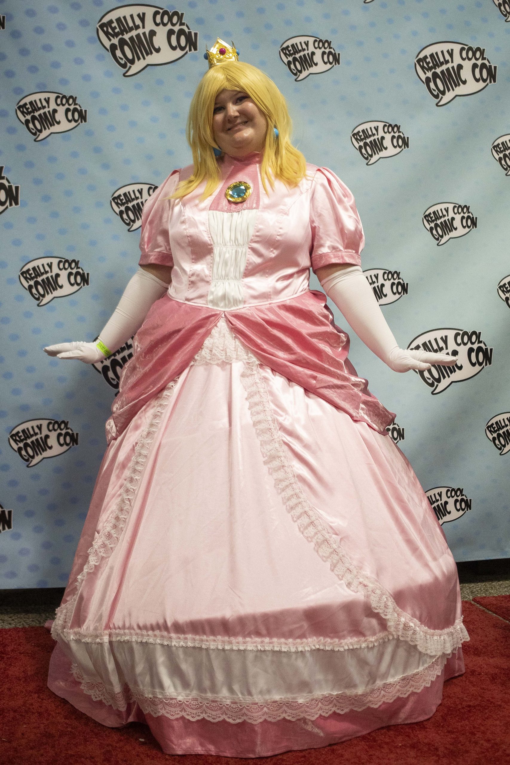 Danielle Abraham cosplays as Princess Peach from the “Super Mario” series during Really Cool Comic Con on Sunday, Aug. 6, 2023, at the Dort Financial Center in Flint.