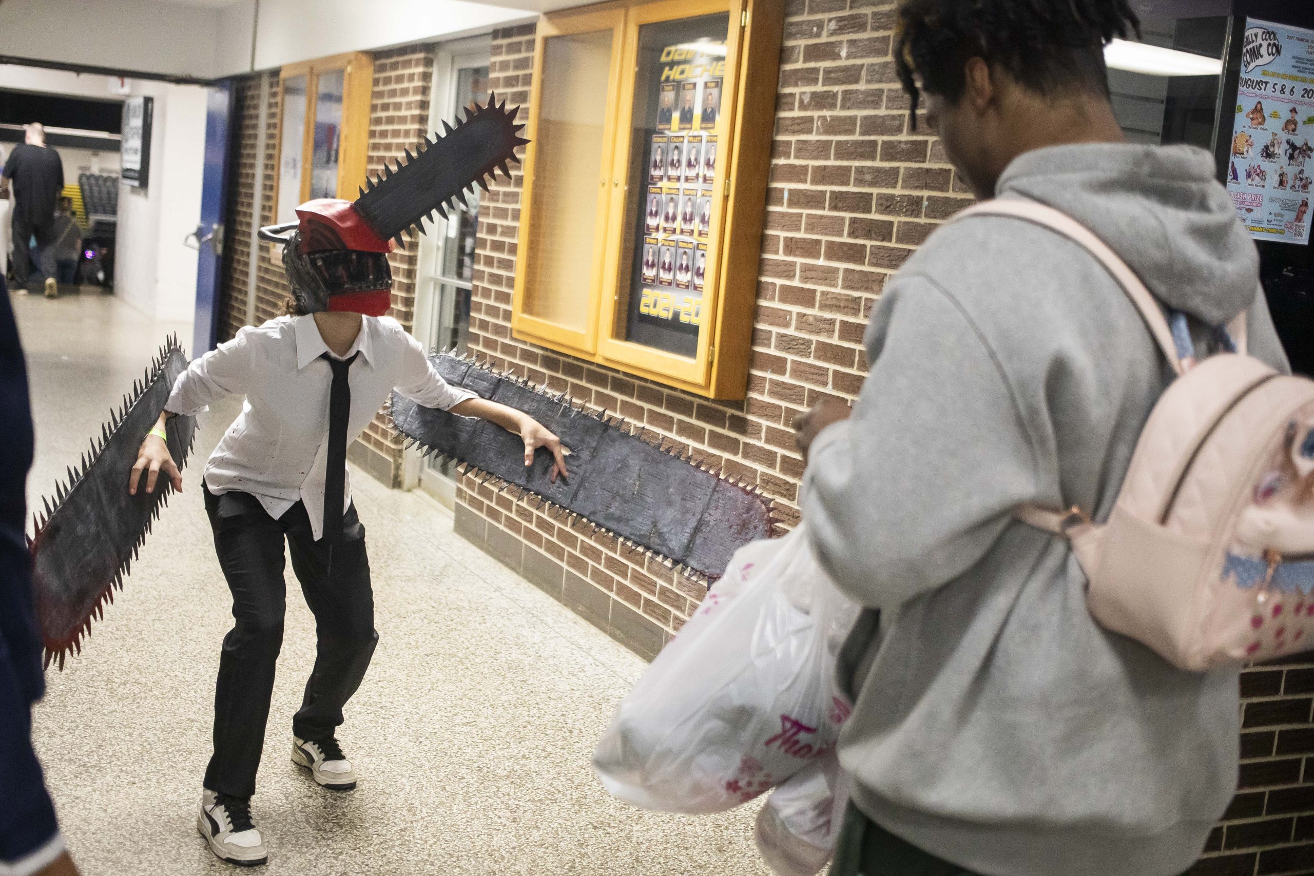 Cosplayers take photos of each other during Really Cool Comic Con on Sunday, Aug. 6, 2023, at the Dort Financial Center in Flint.