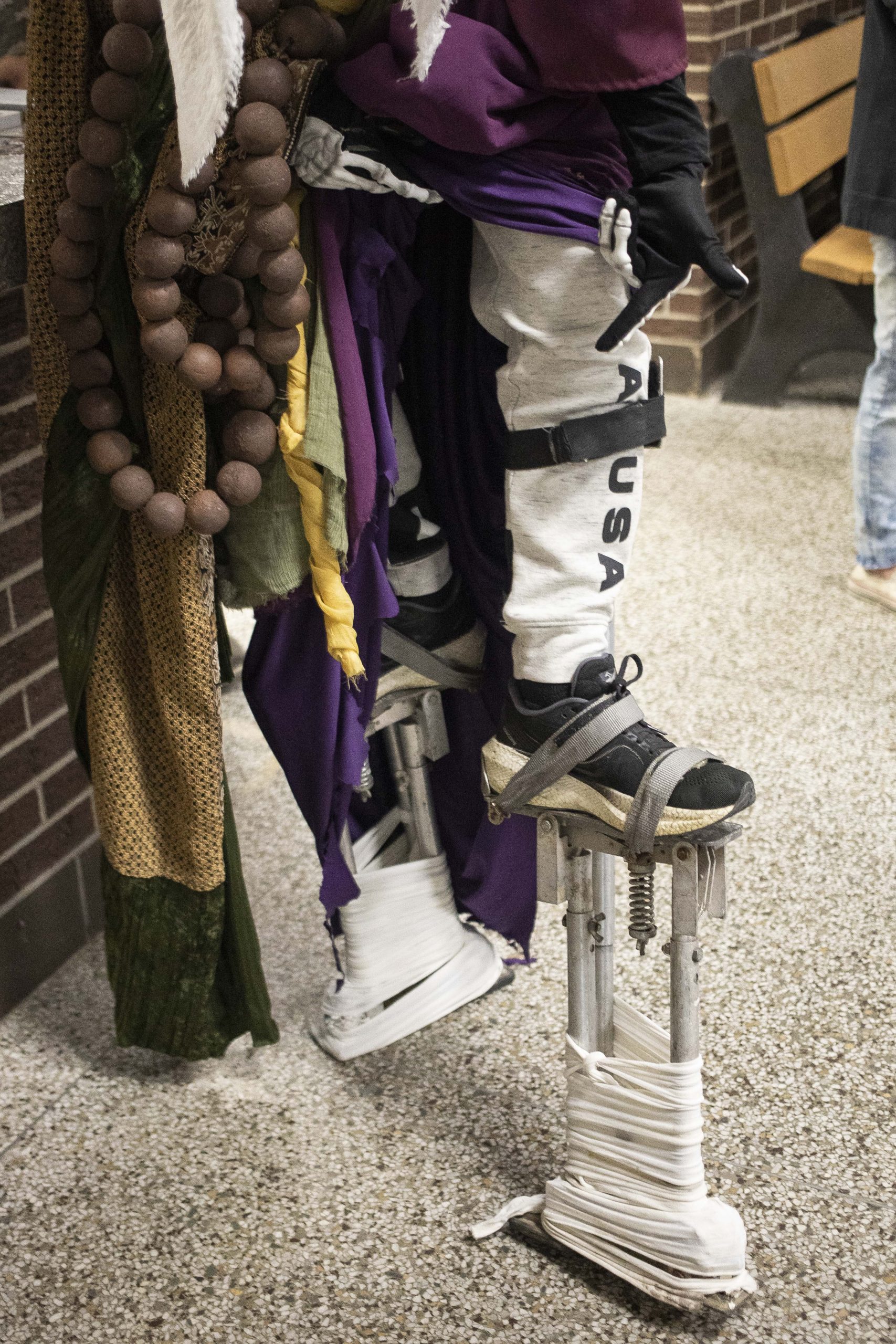 Vincent Pattinson adjusts his stilts while cosplaying as Corrupted Monk from “Sekiro: Shadows Die Twice” during Really Cool Comic Con on Sunday, Aug. 6, 2023, at the Dort Financial Center in Flint.
