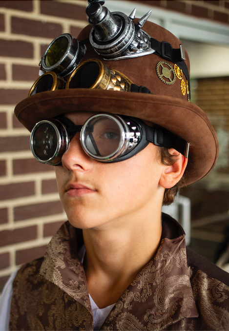 Landin Struck-Curtis wears a steampunk-inspired outfit during Really Cool Comic Con on Sunday, Aug. 6, 2023, at the Dort Financial Center in Flint.

