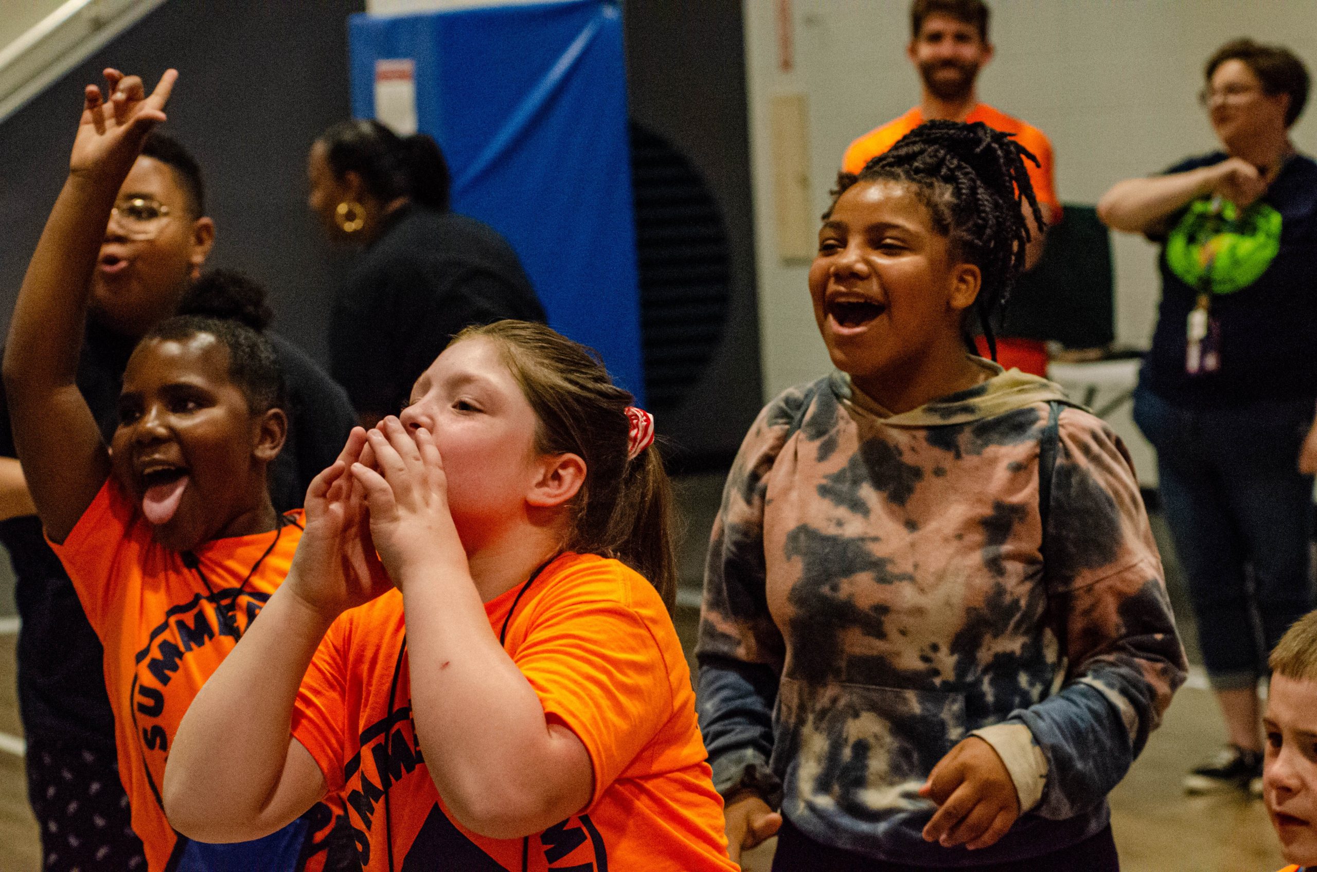 An excited group of kids cheer during a match at the 'Lockdown Pro Wrestling Fundraiser' at Sylvester Broome Empowerment Village on Thursday, July 13, 2023. (Rayford Gray | Flintside)