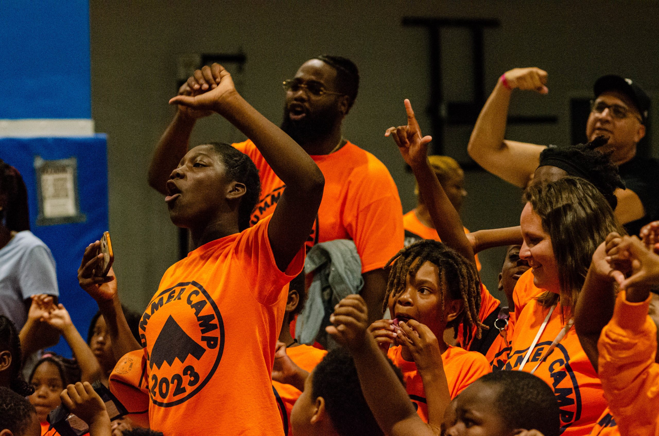 An excited group of kids cheer during a match at the 'Lockdown Pro Wrestling Fundraiser' at Sylvester Broome Empowerment Village on Thursday, July 13, 2023. (Rayford Gray | Flintside)