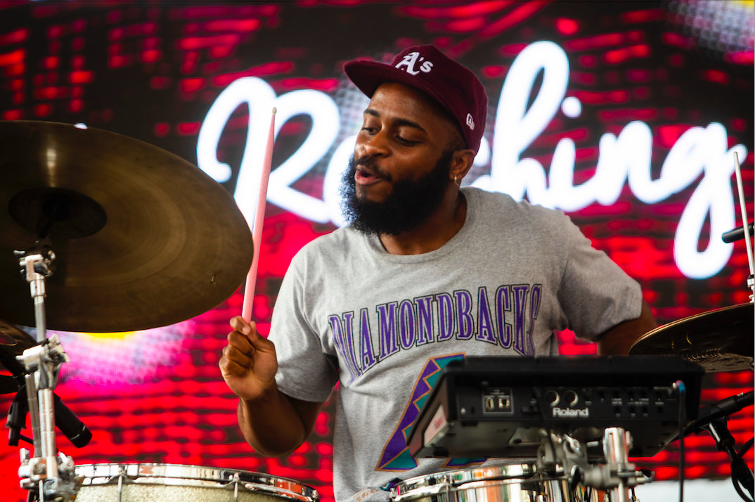 Caleb Robinson + Reaching perform as hundreds of people gather in downtown Flint's Buckham Alley for Alley Fest on Saturday, July 8, 2023. (Katy Kildee | Flintside)