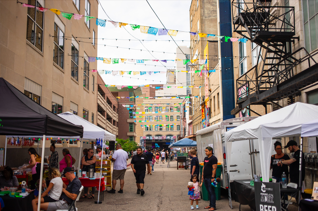 Hundreds of people gather in downtown Flint's Buckham Alley for Alley Fest on Saturday, July 8, 2023. (Katy Kildee | Flintside)