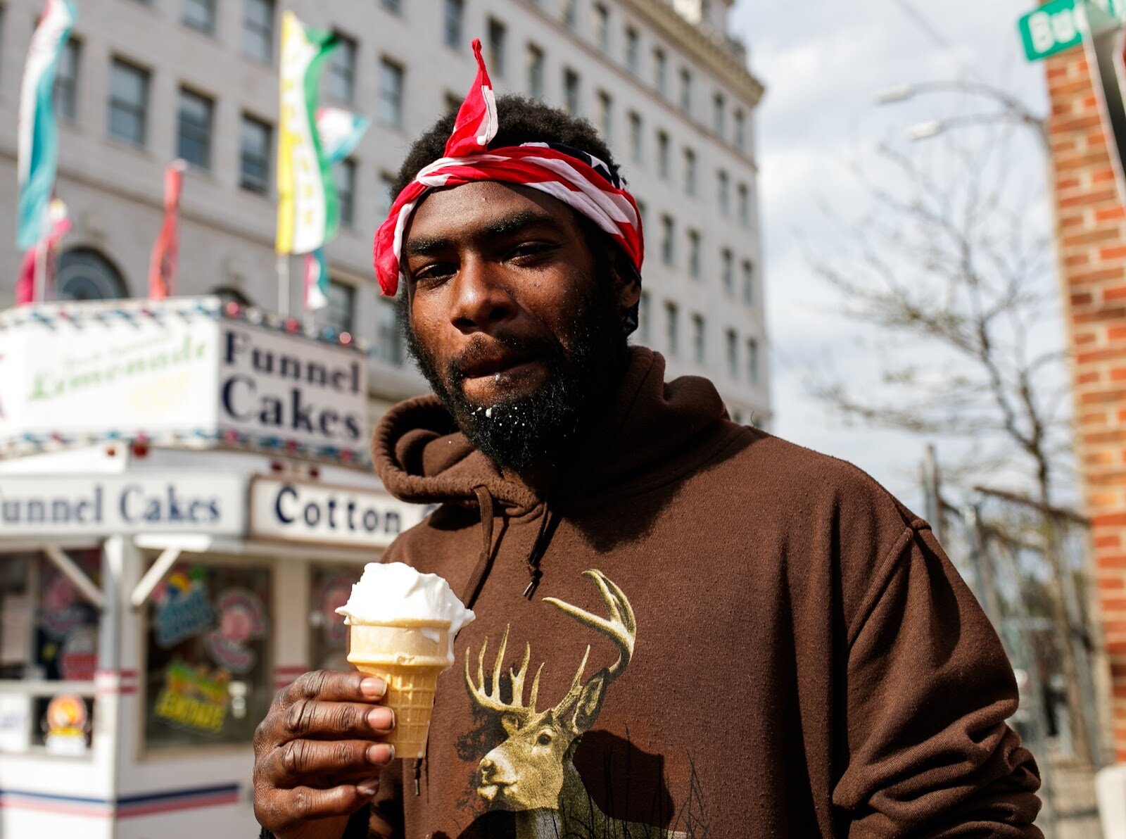 Kevin enjoys an ice cream cone during the Latinx Technology & Community Center’s Cinco de Mayo celebration on Friday, May 5, 2023, in Buckham Alley in downtown Flint. (Jenifer Veloso | Flintside)
