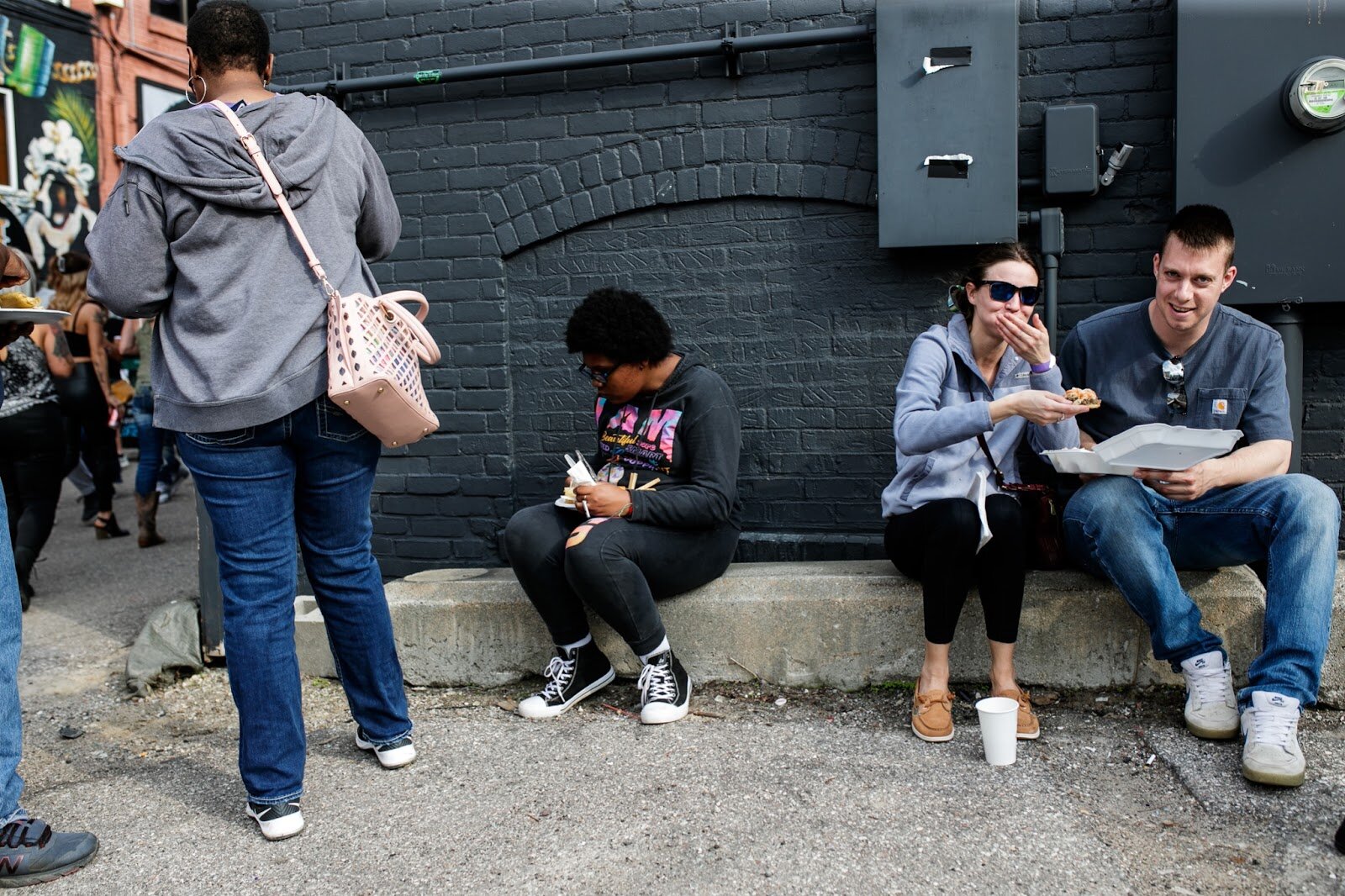 Attendants enjoy authentic Hispanic foods during the Latinx Technology & Community Center’s Cinco de Mayo celebration on Friday, May 5, 2023, in Buckham Alley in downtown Flint. (Jenifer Veloso | Flintside)
