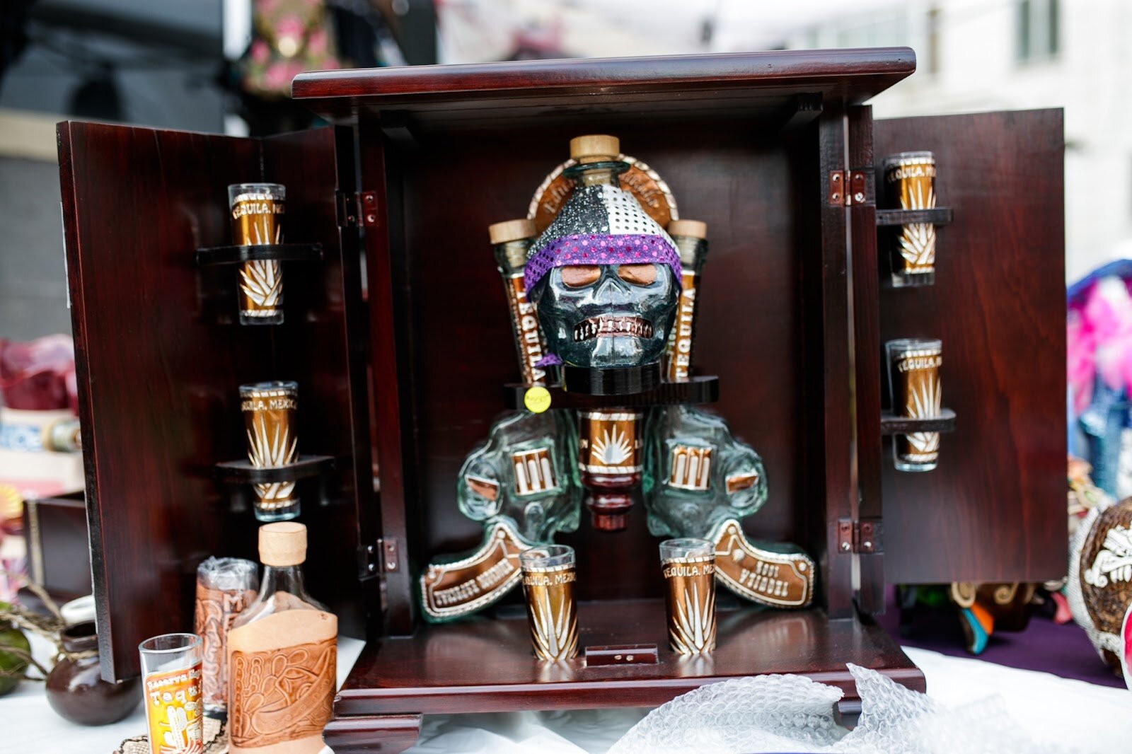 An elaborate tequila case sits on display during the Latinx Technology & Community Center’s Cinco de Mayo celebration on Friday, May 5, 2023, in Buckham Alley in downtown Flint. (Jenifer Veloso | Flintside)
