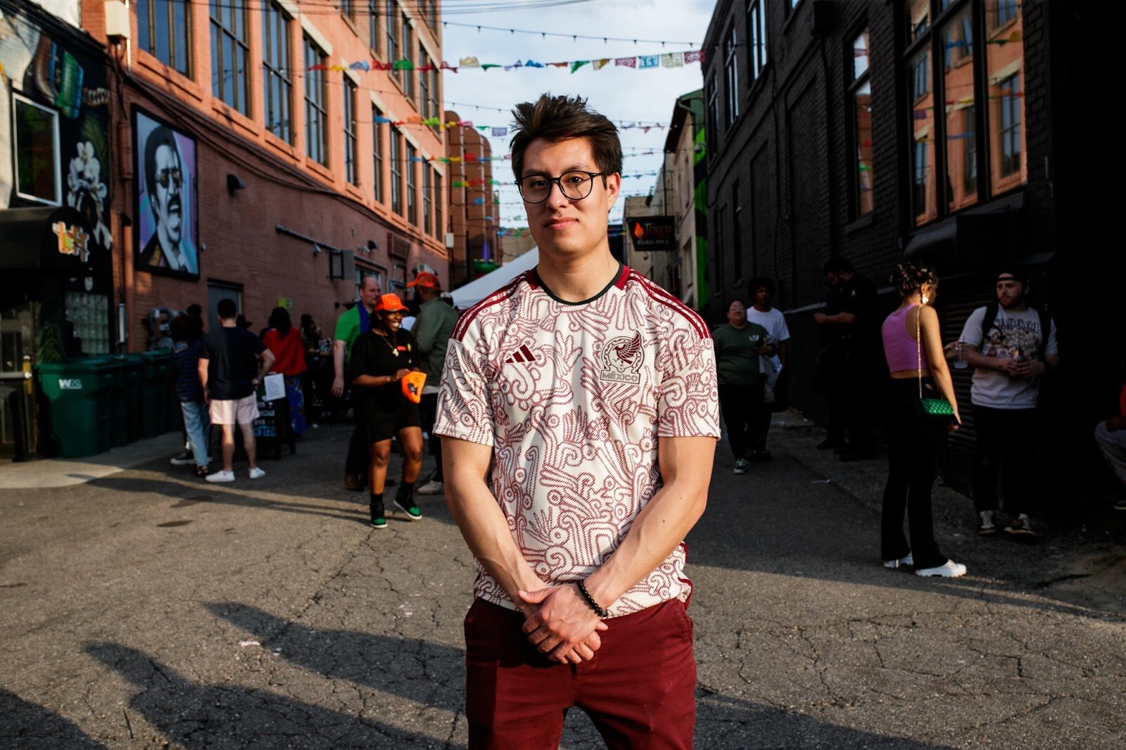 Cristiano Rodriguez, 23, poses for a portrait during the Latinx Technology & Community Center’s Cinco de Mayo celebration on Friday, May 5, 2023, in Buckham Alley in downtown Flint. (Jenifer Veloso | Flintside)
