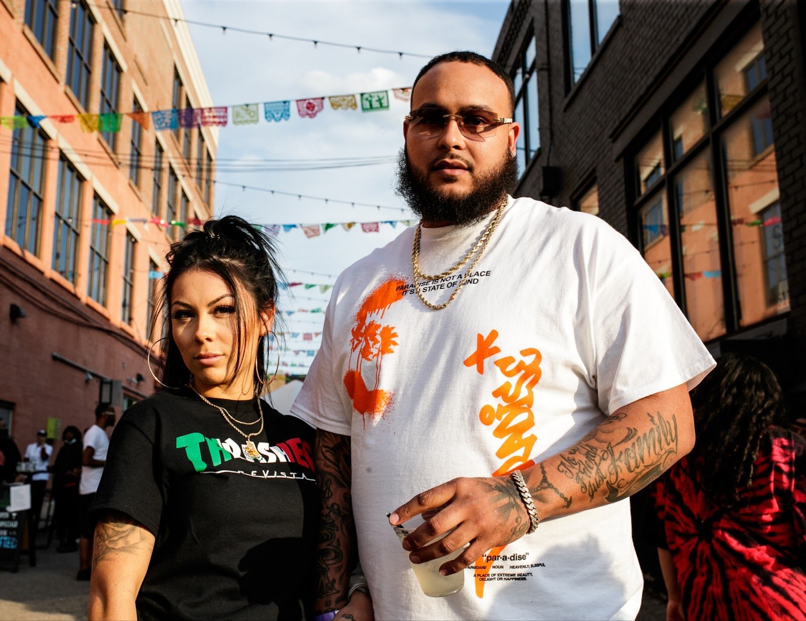 Britt Martinez poses with her boyfriend for a portrait during the Latinx Technology & Community Center’s Cinco de Mayo celebration on Friday, May 5, 2023, in Buckham Alley in downtown Flint. (Jenifer Veloso | Flintside)
