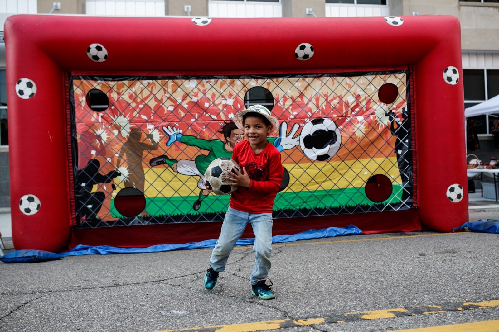 Matteo Kidd, 6, plays fÃºtbol during the Latinx Technology & Community Center’s Cinco de Mayo celebration on Friday, May 5, 2023, in Buckham Alley in downtown Flint. (Jenifer Veloso | Flintside)
