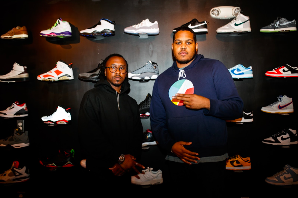 Co-owner Lee Grant Allen and Boys & Girls Club program coordinator Kendall Williams pose for a photo on Tuesday, May 2, 2023, at BAU-HOUSE in downtown Flint. (Jenifer Veloso | Flintside)