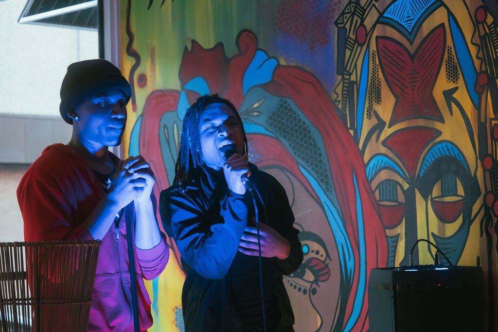 Local music duo FliCity Twinzz perform during Open Mic Night at Comma Bookstore & Social Hub on Friday, April 7, 2023. (Mike Powell | Flintside)