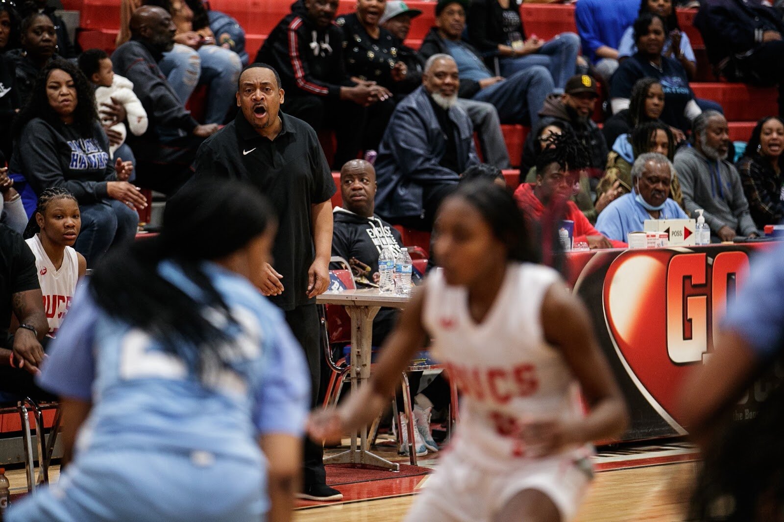 Beecher girls varsity Head Coach Spencer Eason calls out to his team during the girls' varsity basketball game on Saturday, Feb. 18, 2023, at the Moses Lacey Fieldhouse in Mount Morris. Hamady defeated Beecher girls 49-45. (Jenifer Veloso | Flintside)
