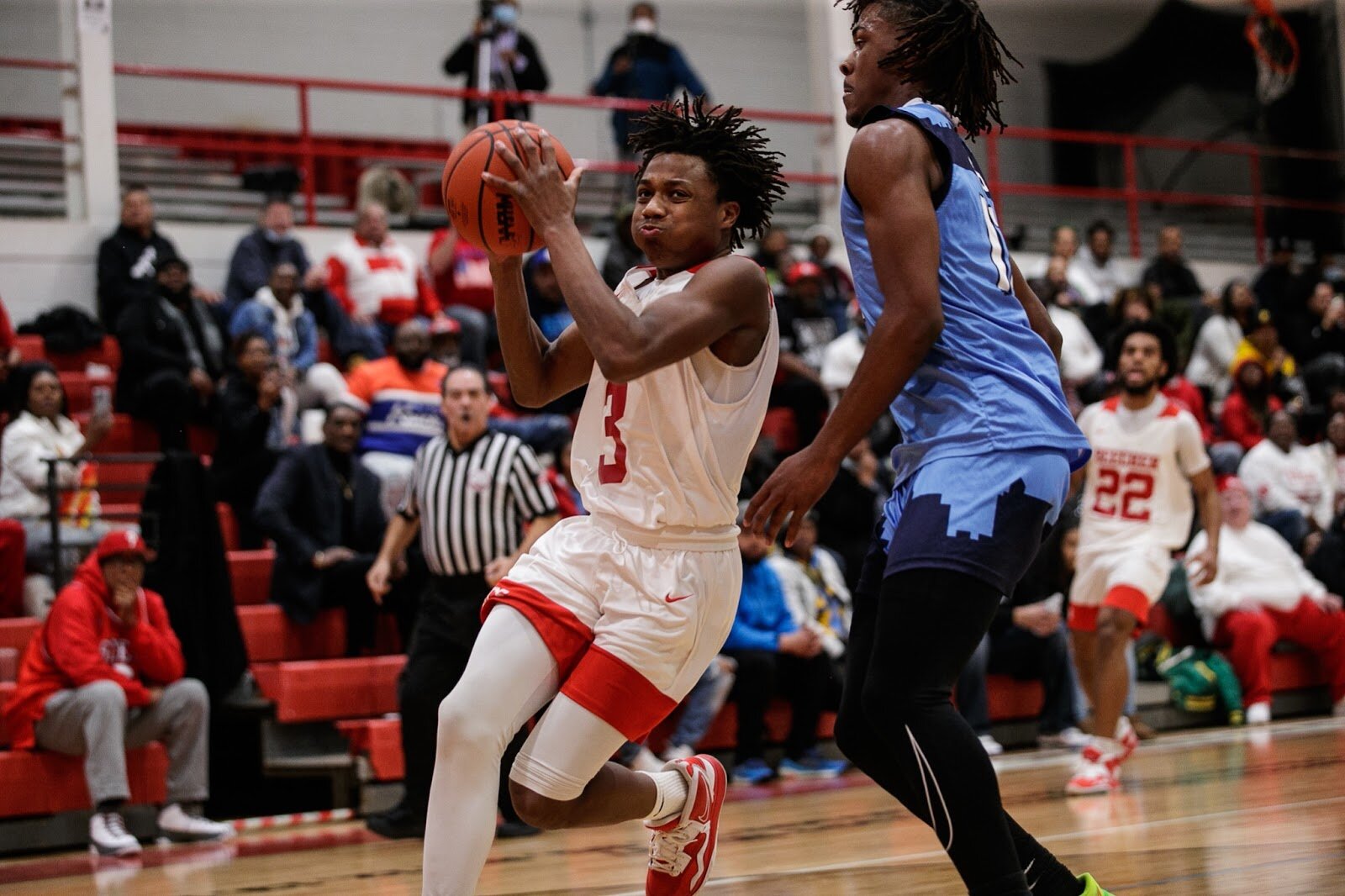 Beecher senior Jacoby Holliday Jr. makes his way past Hamady's defense during the boys' varsity basketball game on Saturday, Feb. 18, 2023, at the Moses Lacey Fieldhouse in Mount Morris. Beecher defeated Hamady 48-43. (Jenifer Veloso | Flintside)
