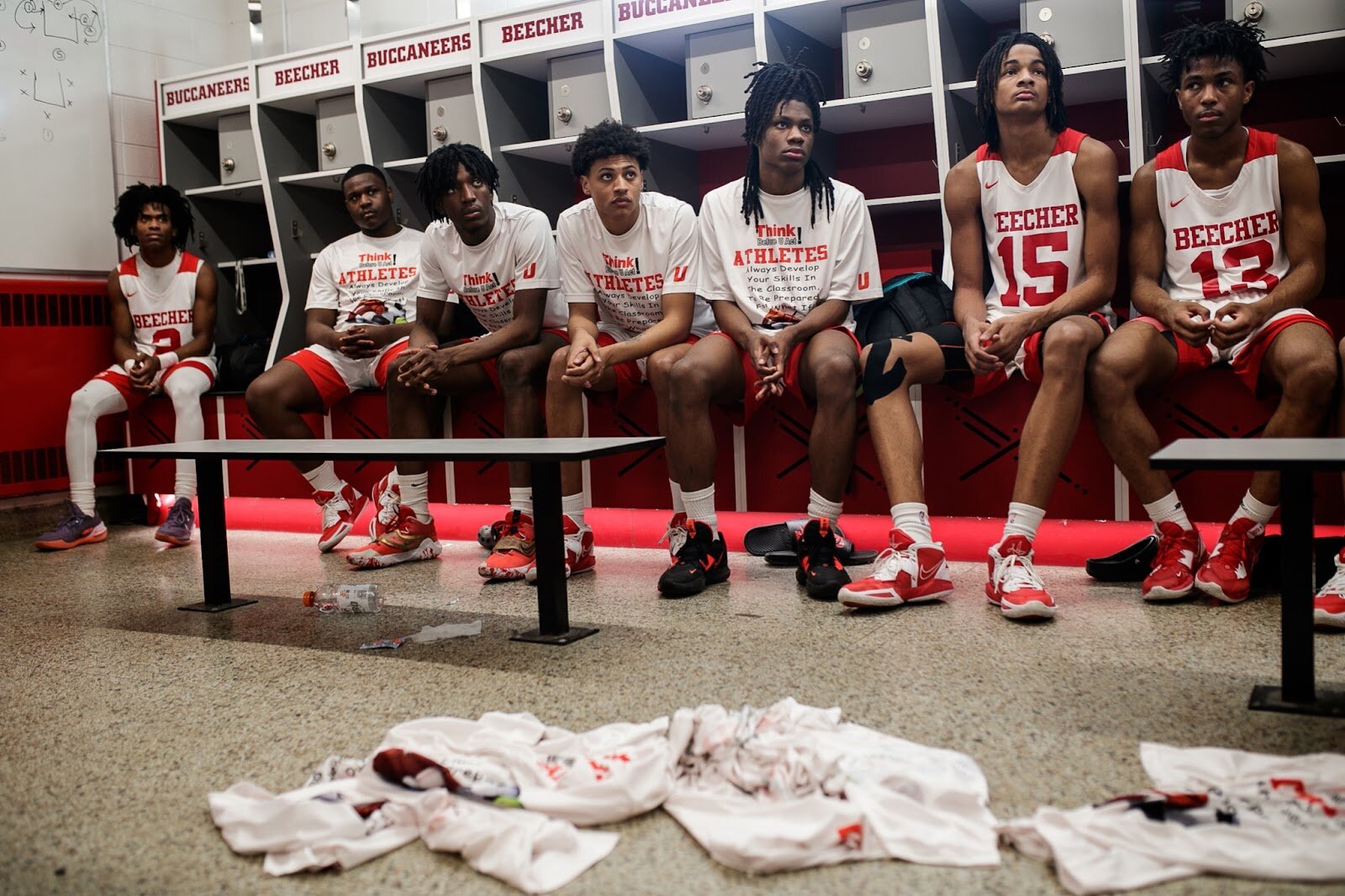 Beecher varsity players listen to Head Coach Marquise Gray during half-time at the boys' varsity basketball game on Saturday, Feb. 18, 2023, at the Moses Lacey Fieldhouse in Mount Morris. Beecher defeated Hamady 48-43. (Jenifer Veloso | Flintside)

