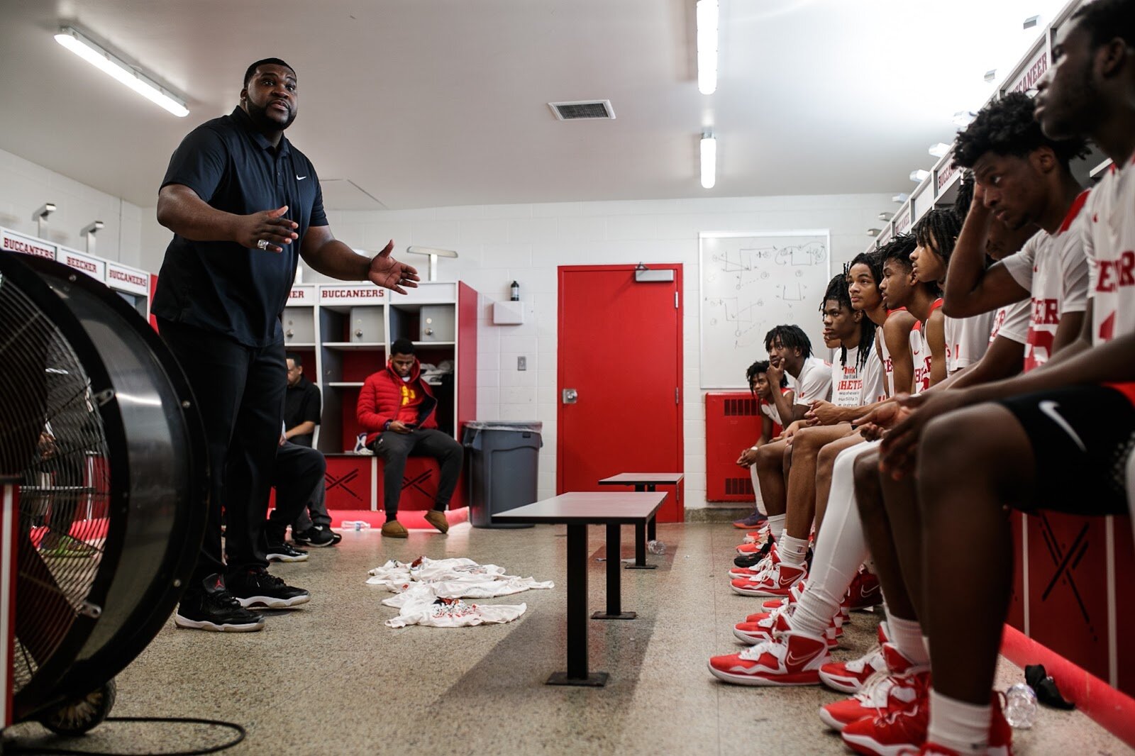 Beecher Head Coach Marquise Gray talks to his team during half-time at the boys' varsity basketball game on Saturday, Feb. 18, 2023, at the Moses Lacey Fieldhouse in Mount Morris. Beecher defeated Hamady 48-43. (Jenifer Veloso | Flintside)
