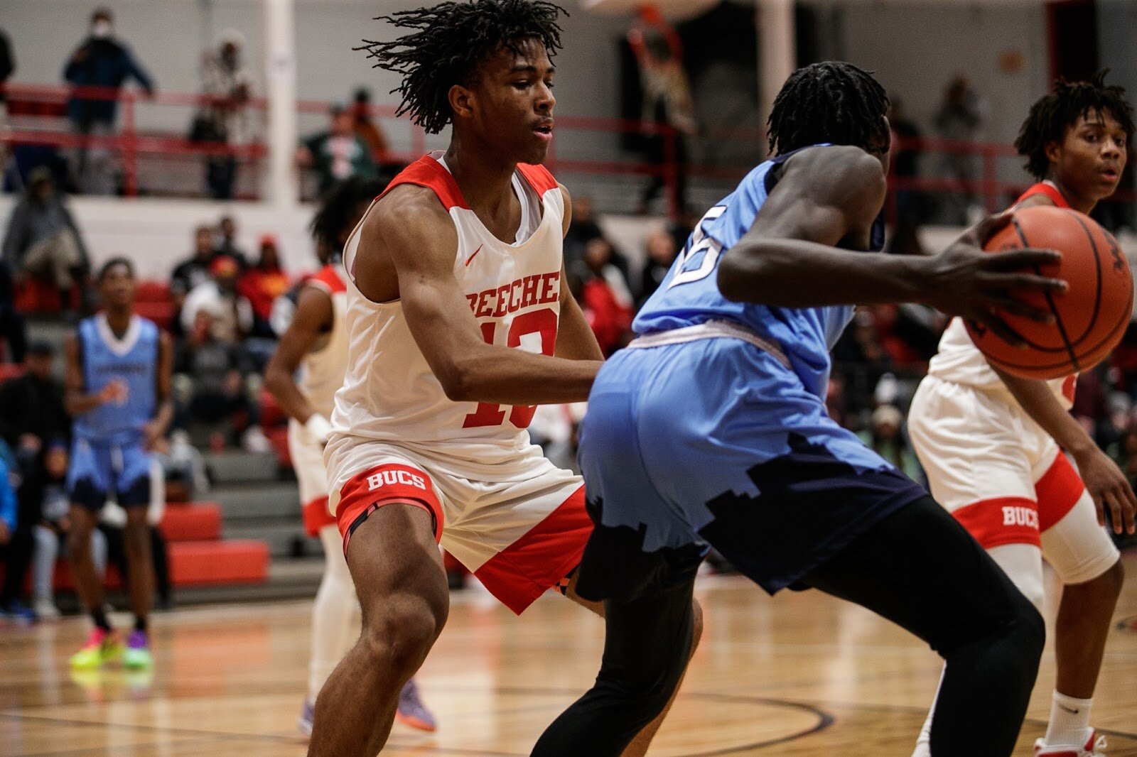 Beecher junior Damarcus Burke defends the basket during the boys' varsity basketball game on Saturday, Feb. 18, 2023, at the Moses Lacey Fieldhouse in Mount Morris. Beecher defeated Hamady 48-43. (Jenifer Veloso | Flintside)
