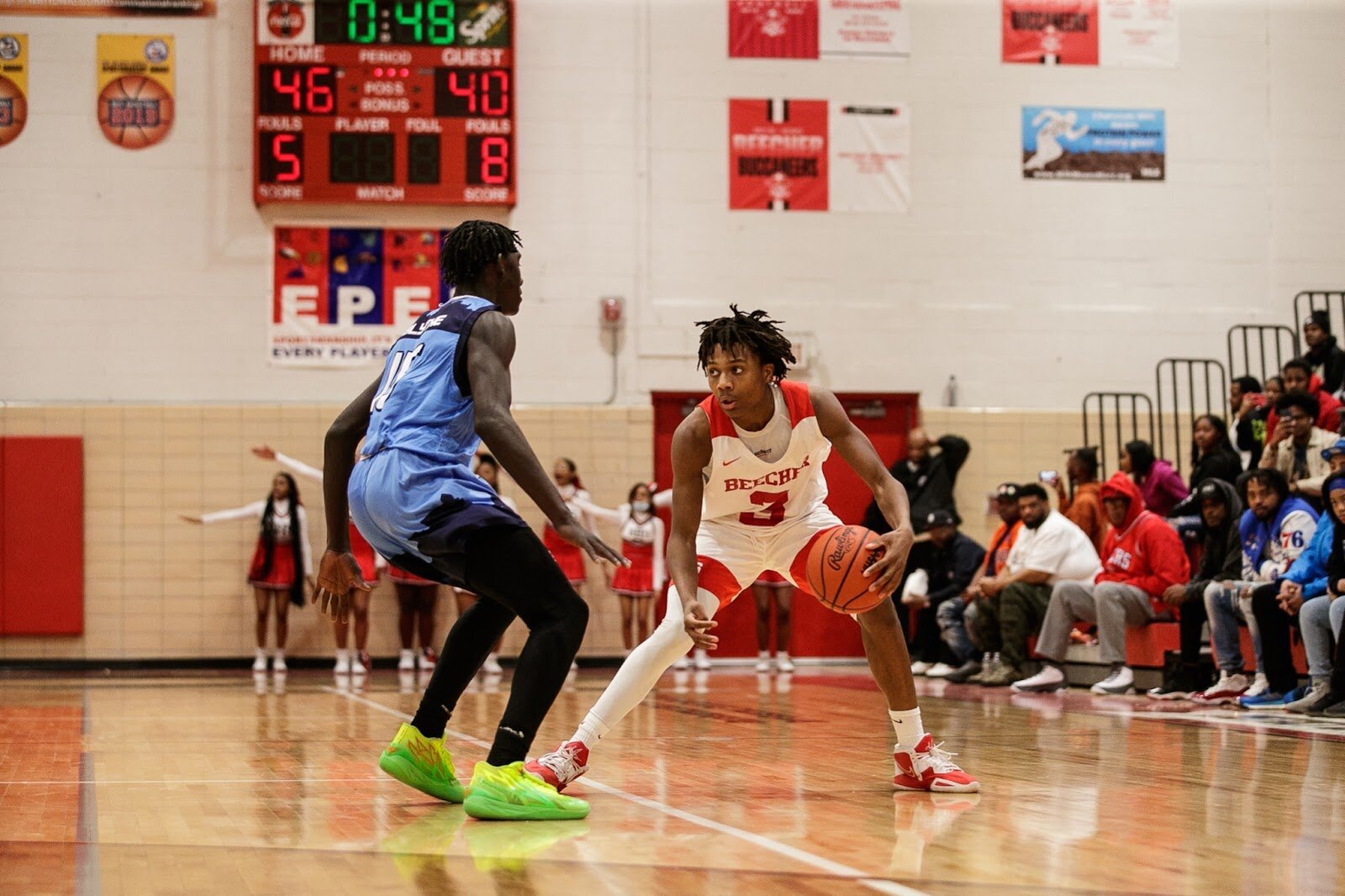 Beecher senior Jacoby Holliday Jr. keeps possession of the ball during the boys' varsity basketball game on Saturday, Feb. 18, 2023, at the Moses Lacey Fieldhouse in Mount Morris. Beecher defeated Hamady 48-43. (Jenifer Veloso | Flintside)
