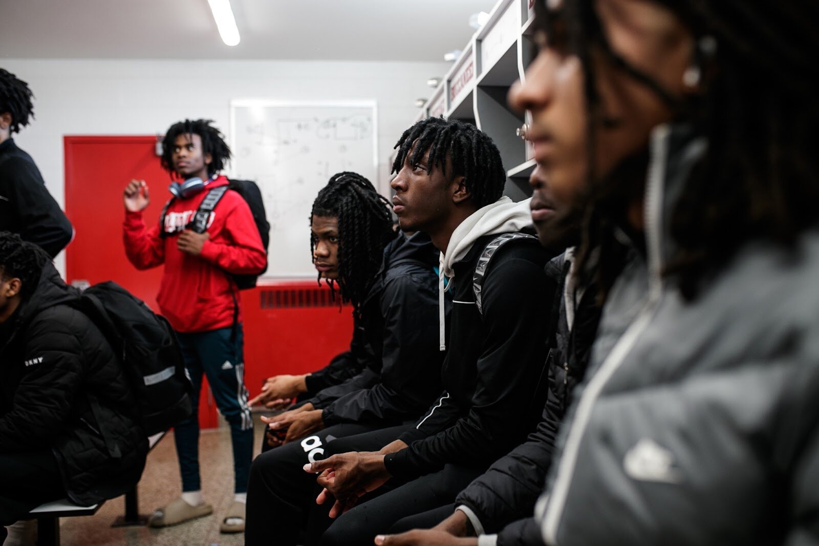 Beecher varsity basketball players listen to Head Coach Marquise Gray after the boys' varsity basketball game on Saturday, Feb. 18, 2023, at the Moses Lacey Fieldhouse in Mount Morris. Beecher defeated Hamady 48-43. (Jenifer Veloso | Flintside)
