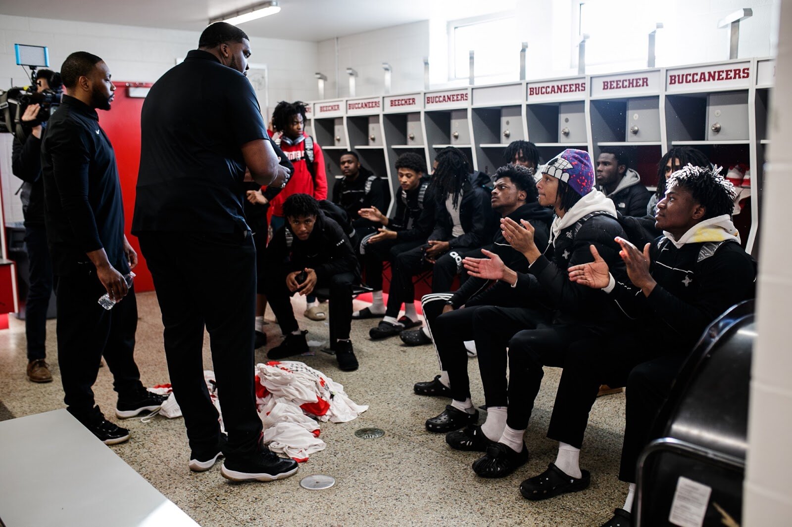 Beecher Head Coach Marquise Gray talks to his team after the boys' varsity basketball game on Saturday, Feb. 18, 2023, at the Moses Lacey Fieldhouse in Mount Morris. Beecher defeated Hamady 48-43 (Jenifer Veloso | Flintside)
