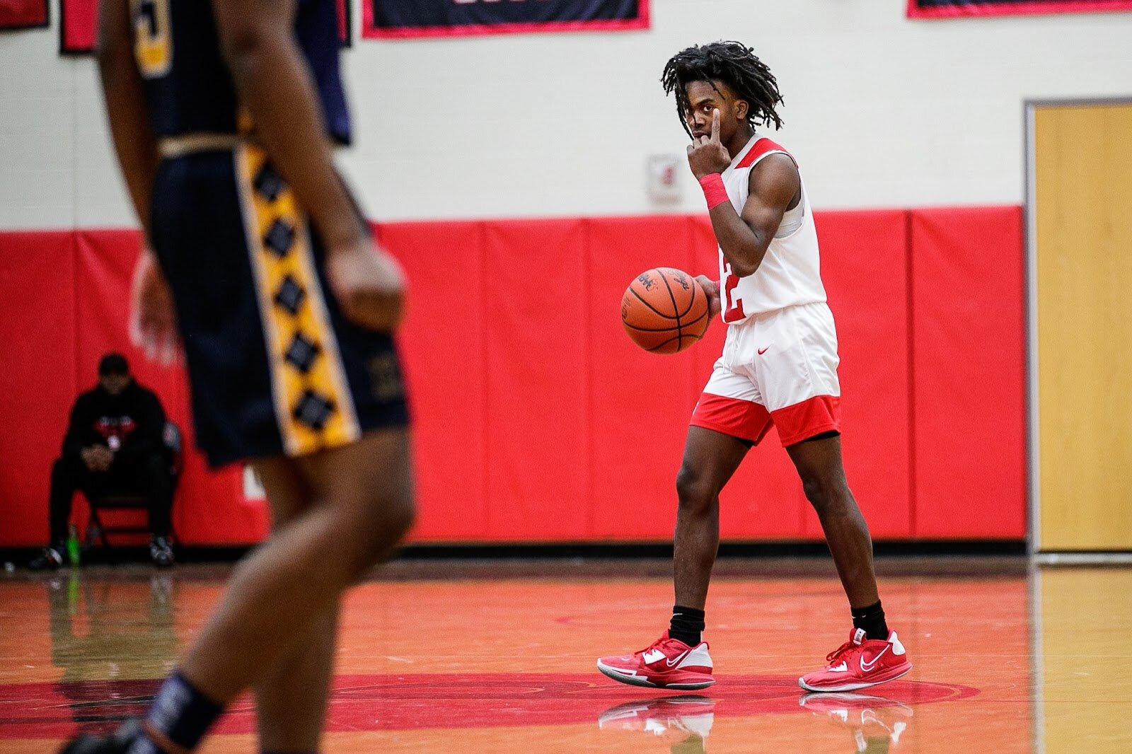 Beecher junior Keyonta Menefield signals a play to his teammates during the Beecher vs Saginaw Arthur Hill game at Grand Blanc High School for The Carmody Classic on Saturday, Jan. 07, 2022. Beecher defeated Arthur Hill 77-44 (Jenifer Veloso | Flintside)
