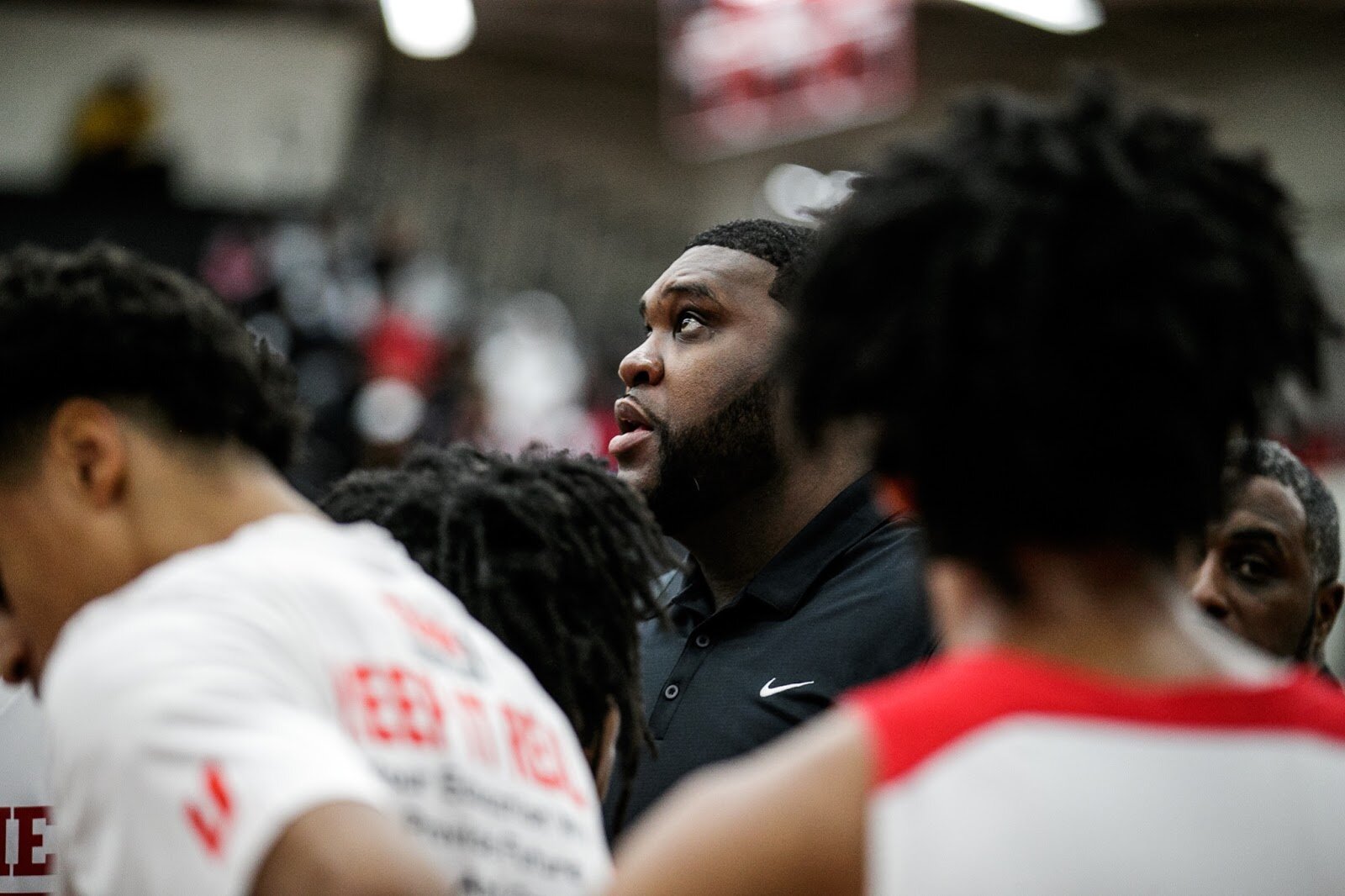 Beecher Head Coach Marquise’ Gray looks at the scoreboard after a time-out during the Beecher vs Saginaw Arthur Hill game at Grand Blanc High School for The Carmody Classic on Saturday, Jan. 07, 2022. Beecher defeated Arthur Hill 77-44 (Jenifer Veloso | Flintside)
