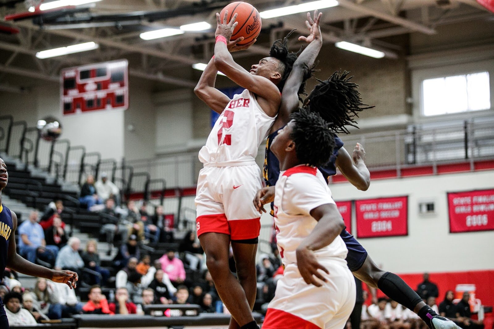 Beecher junior Keyonta Menefield pushes past the defense to shoot a field goal during the Beecher vs Saginaw Arthur Hill game at Grand Blanc High School for The Carmody Classic on Saturday, Jan. 07, 2022. Beecher defeated Arthur Hill 77-44 (Jenifer Veloso | Flintside)
