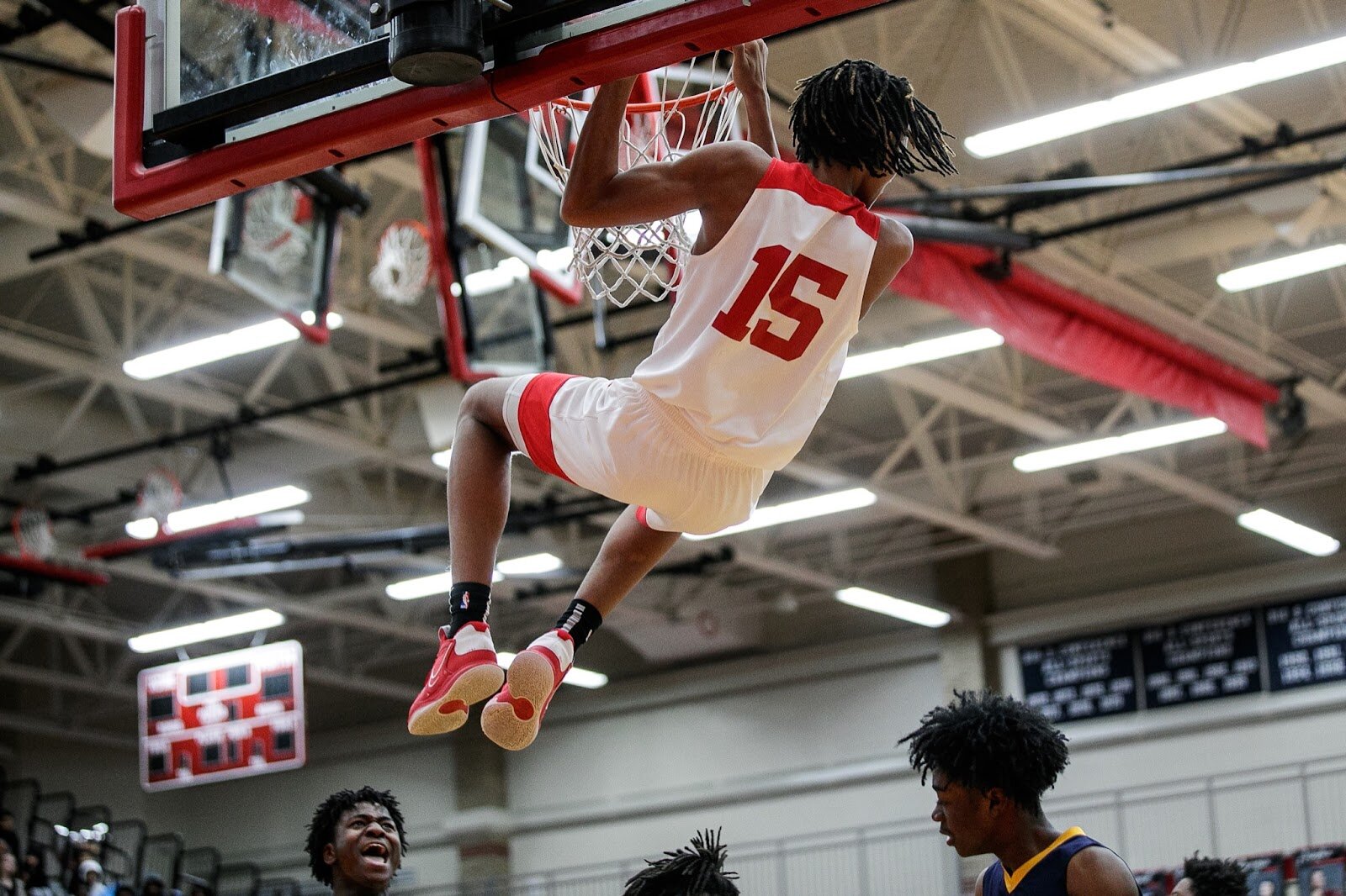 Beecher sophomore Wasir James dunks during the Beecher vs Saginaw Arthur Hill game at Grand Blanc High School for The Carmody Classic on Saturday, Jan. 07, 2022. Beecher defeated Arthur Hill 77-44 (Jenifer Veloso | Flintside)
