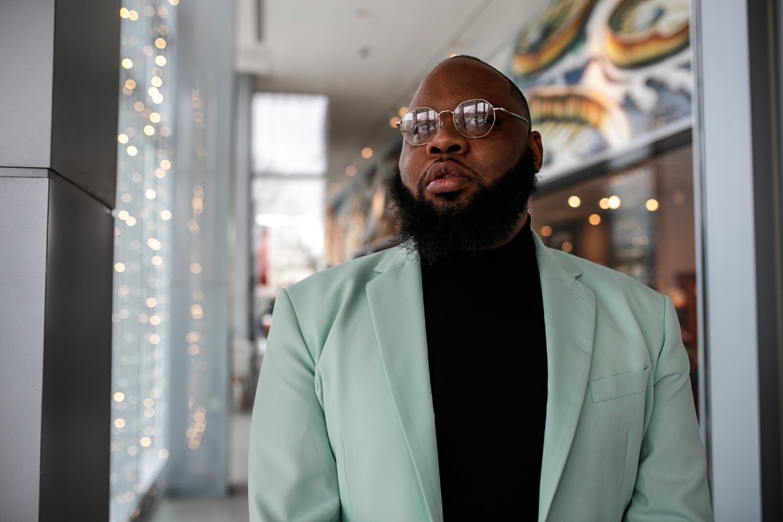 Brandon Corder, founder of Beats x Beers, poses for a portrait during the third annual Toast Awards, hosted by Beats x Beers, at the Flint Institute of Arts on Saturday, Dec. 17, 2022. (Jenifer Veloso | Flintside)
