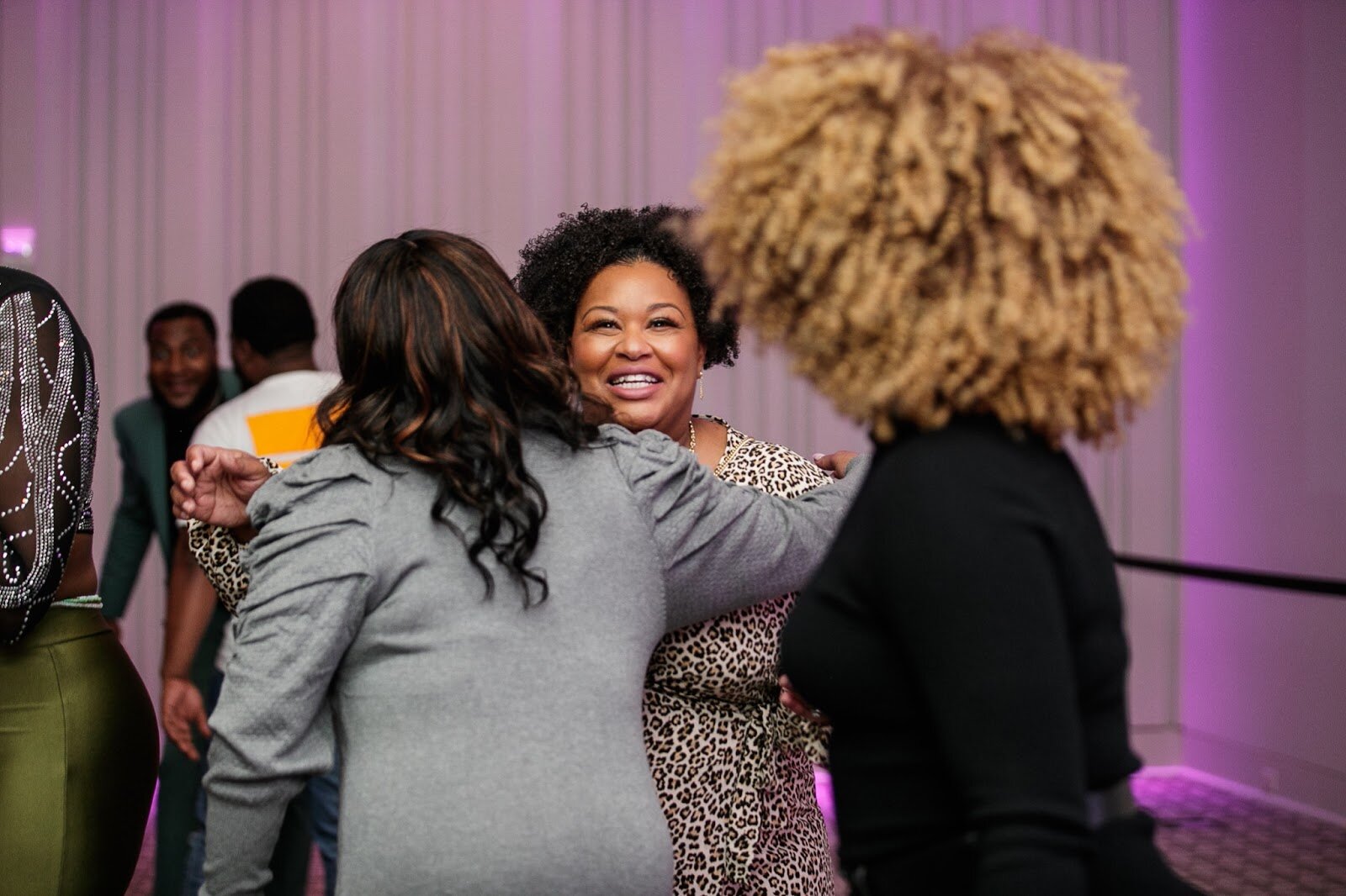 Natalie Kadie greets a fellow guest during the third annual Toast Awards, hosted by Beats x Beers, at the Flint Institute of Arts on Saturday, Dec. 17, 2022. (Jenifer Veloso | Flintside)
