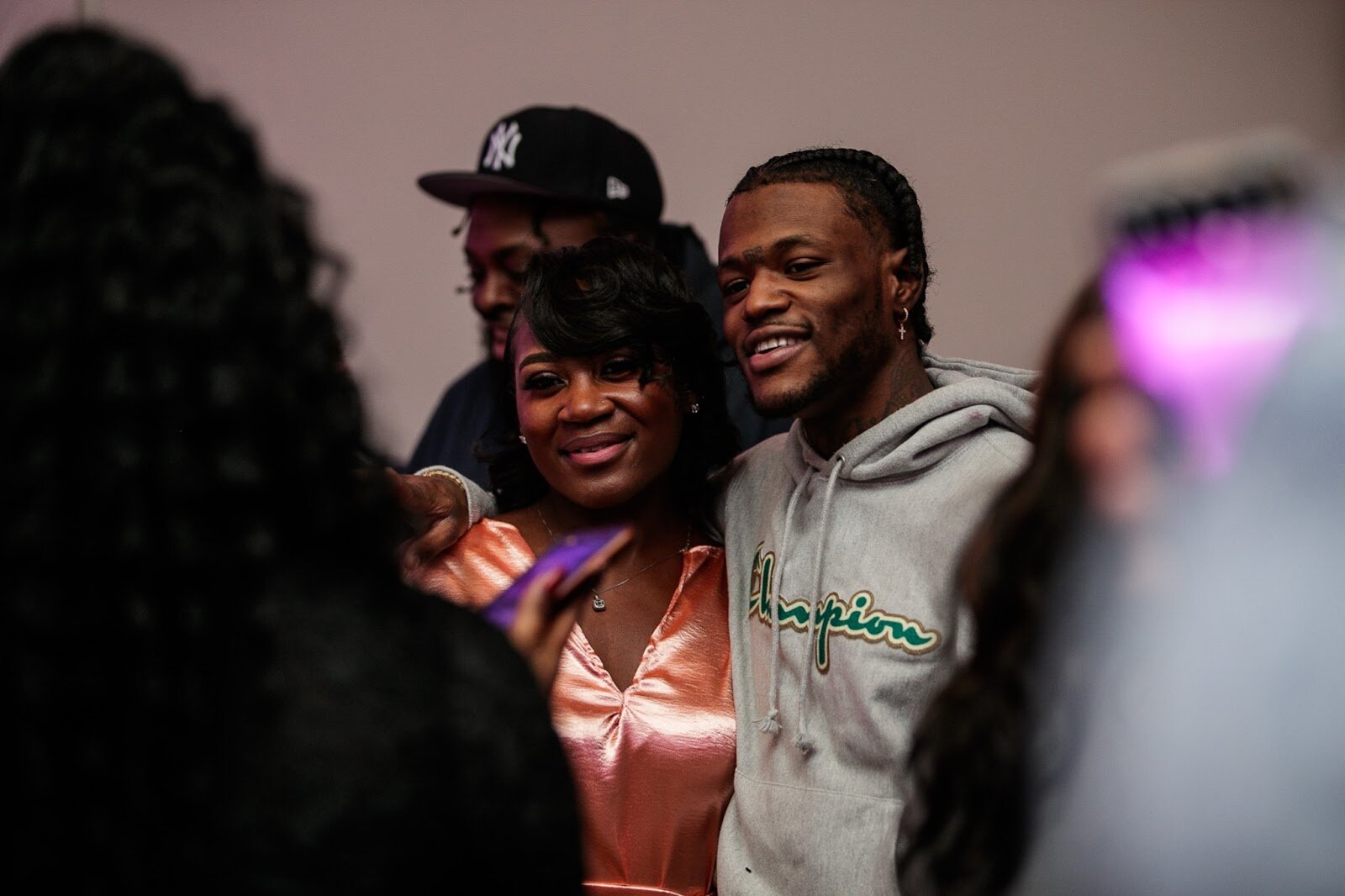 Actor and comedian DC Young Fly poses for a portrait with a guest during the third annual Toast Awards, hosted by Beats x Beers, at the Flint Institute of Arts on Saturday, Dec. 17, 2022. (Jenifer Veloso | Flintside)
