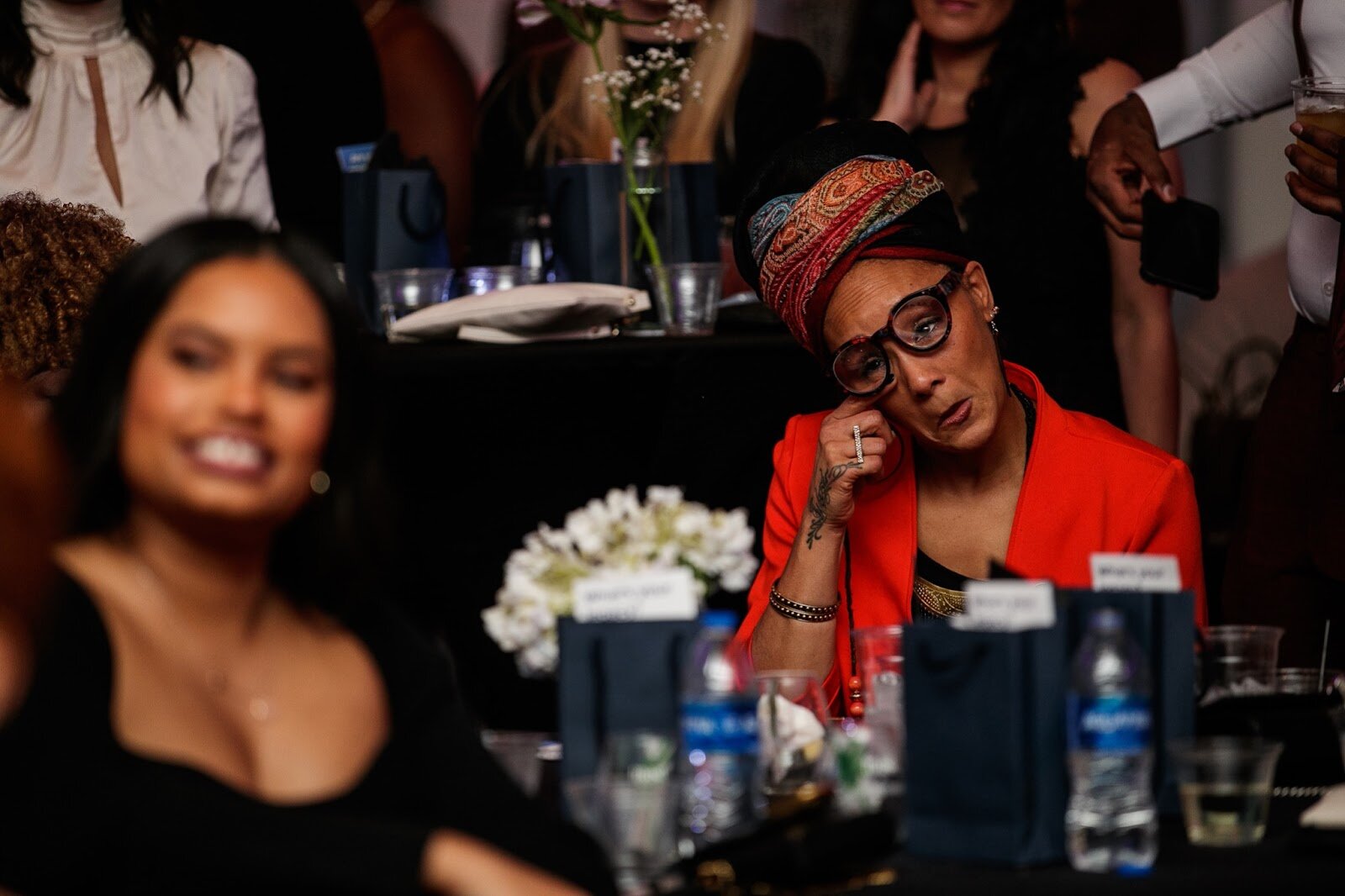 Mama Sol listens and wipes a tear from her face as she is announced as the Trail Blazer award recipient during the third annual Toast Awards, hosted by Beats x Beers, at the Flint Institute of Arts on Saturday, Dec. 17, 2022. (Jenifer Veloso | Flintside)
