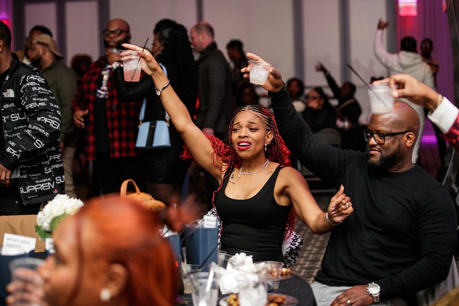 Guests hold their drinks up for a toast during the third annual Toast Awards, hosted by Beats x Beers, at the Flint Institute of Arts on Saturday, Dec. 17, 2022. (Jenifer Veloso | Flintside)
