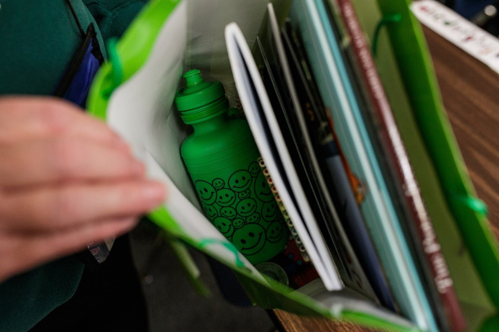 First-grade teacher, Mrs. Sandra Baird shows the items inside each student’s Christmas gift during Freeman Elementary’s holiday celebration of literacy and reading comprehension on Friday, Dec. 16, 2022. (Jenifer Veloso | Flintside)
