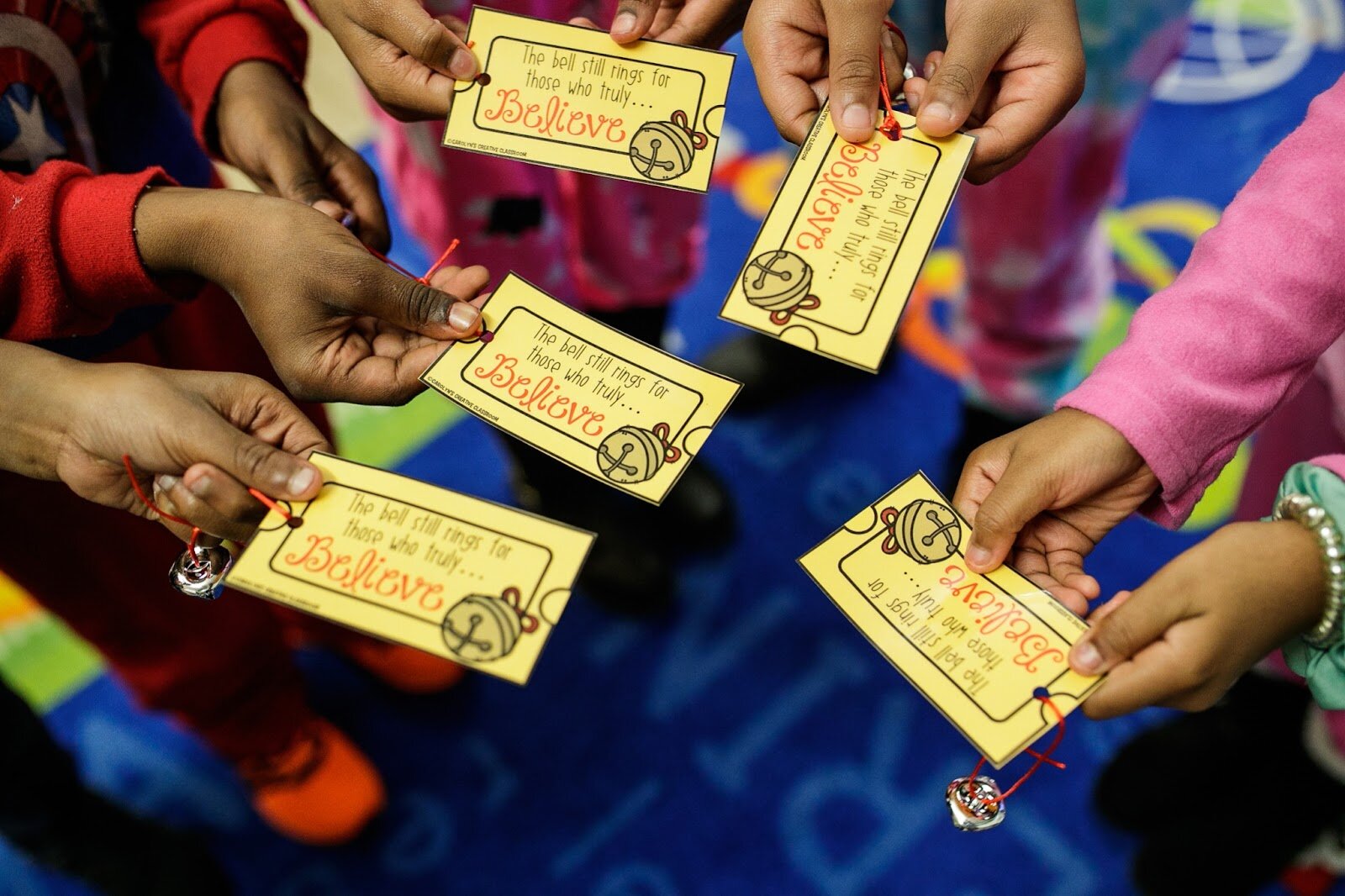 Third-grade Freeman scholars hold their golden ticket for The Polar Express during Freeman Elementary’s holiday celebration of literacy and reading comprehension on Friday, Dec. 16, 2022. (Jenifer Veloso | Flintside)
