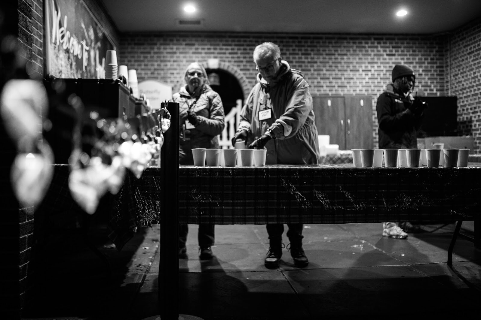 Applewood volunteers hand out free hot cider and cookies during the College Cultural area’s 37th Annual Holiday Walk in Flint on Tuesday, Dec. 6, 2022. (Jenifer Veloso | Flintside)
