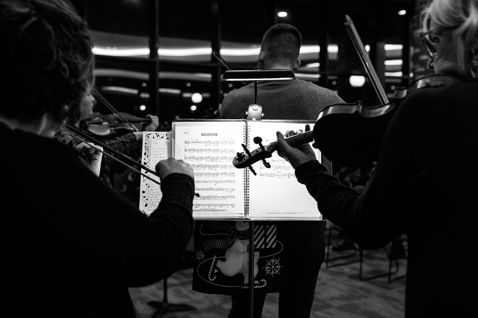 A wind ensemble performs ‘Hallelujah’ inside the Flint Institute of Music during the College Cultural area’s 37th Annual Holiday Walk in Flint on Tuesday, Dec. 6, 2022. (Jenifer Veloso | Flintside)
