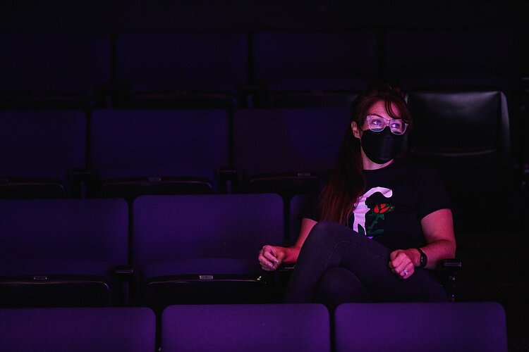 Rhiannon Ragland watches and takes notes while actors perform during rehearsal on the set of The Purple Rose's latest play PickleBall on Friday, Sept. 20, 2022. (Jenifer Veloso | Flintside)