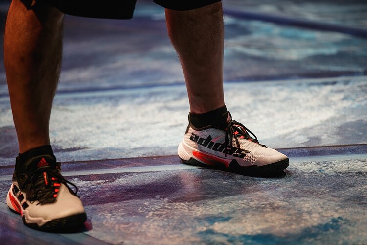 An actor wears a pair of Adidas shoes purchased from the new streetwear store in downtown Flint, BauHouse, as part of his costume during rehearsal for the play Pickleball on Friday, Sept. 30, 2022. (Jenifer Veloso | Flintside)