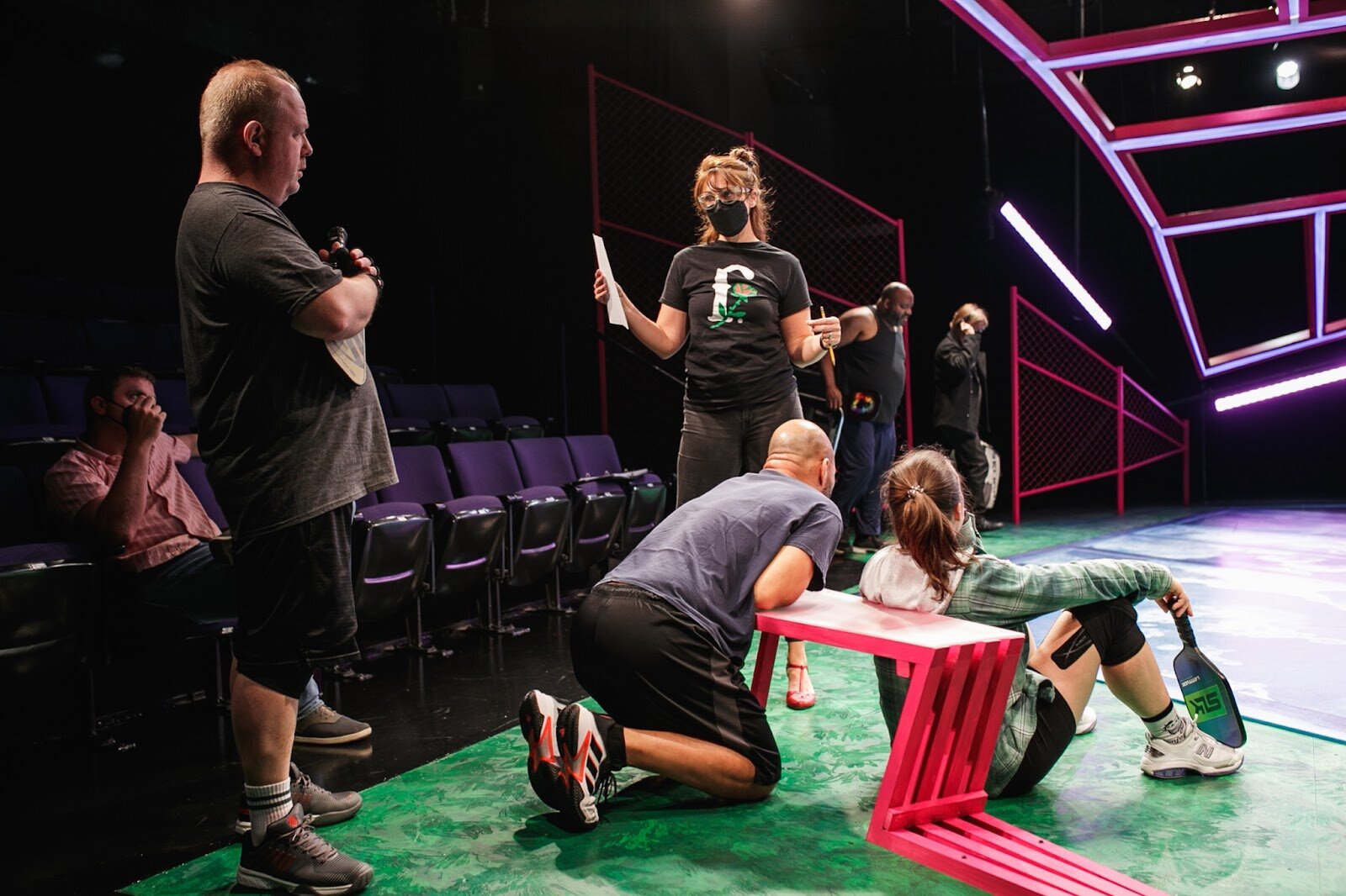 Cast members wait and listen as director Rhiannon Ragland gives suggestions during final rehearsals on the set of The Purple Rose's latest play PickleBall on Friday, Sept. 20, 2022. (Jenifer Veloso | Flintside)