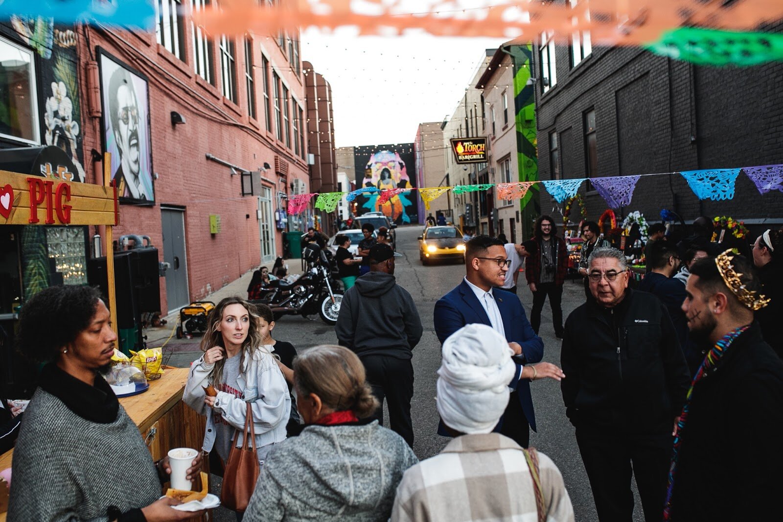 Flint residents and guests gather together during the Latinx Technology and Community Center's Dia de Los Muertos celebration on Wednesday, Nov. 2, 2022 in downtown Flint. (Jenifer Veloso | Flintside)
