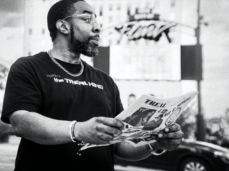 Flint native Jamal Jones reads a copy of the first issue of TREAL Magazine, a news publication he established in 1999.