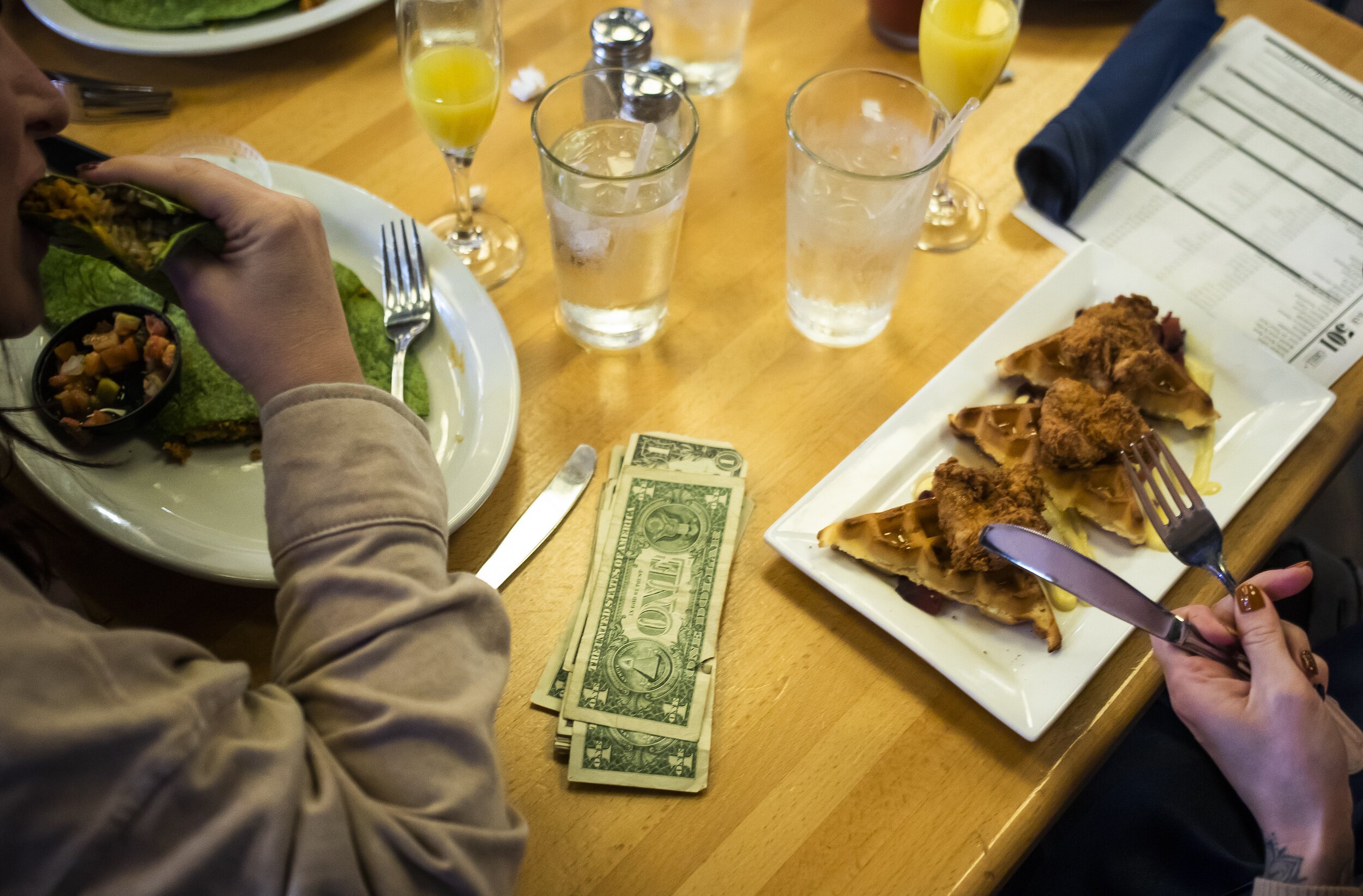 Guests enjoy brunch and cocktails during a Michigan Drag Brunch performance Sunday, Sept. 25, 2022 at 501 Bar and Grill in downtown Flint.